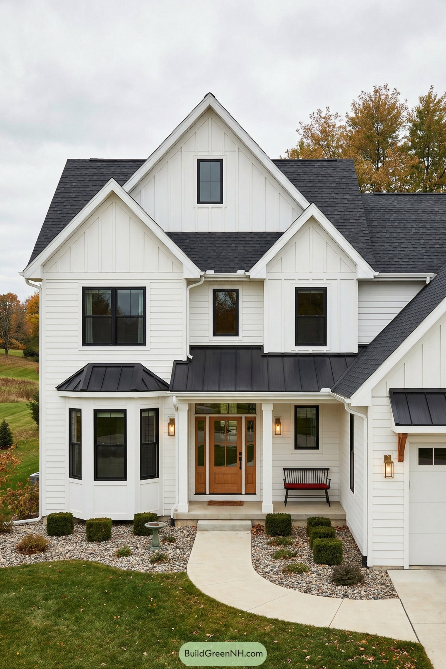 White gabled house with black roof and bay window