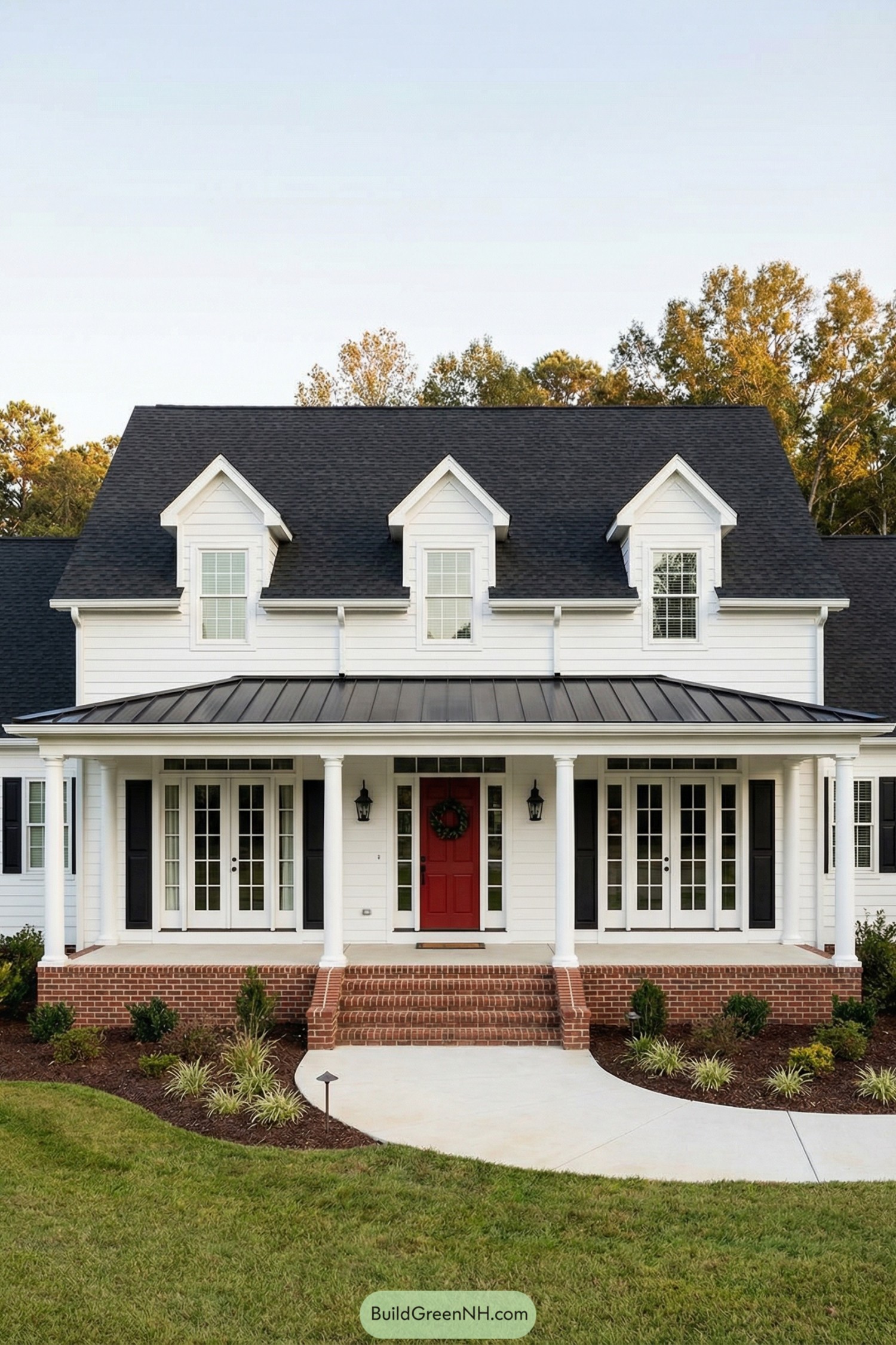 White two story house with black roof and wide front porch