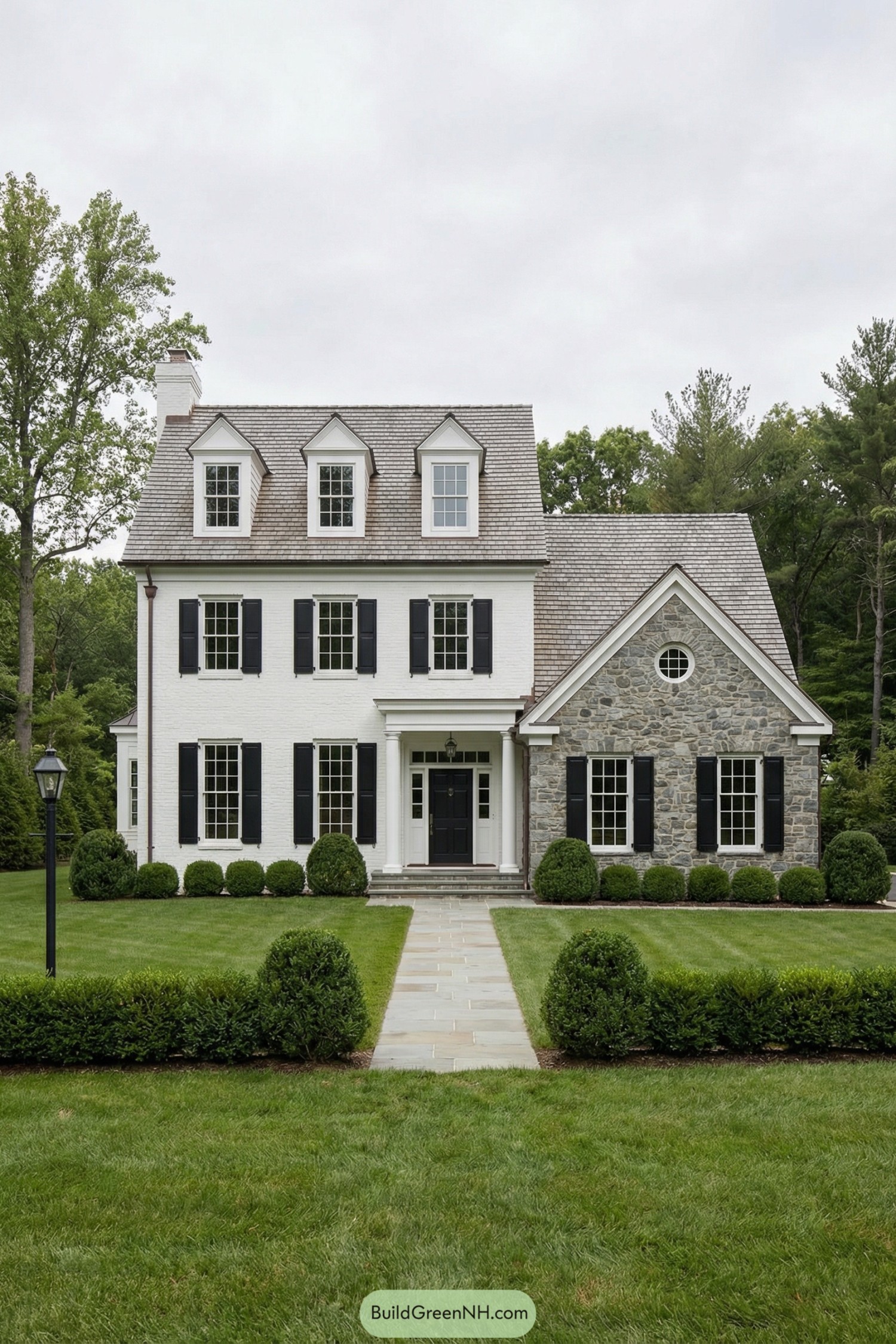 White brick and stone house with black shutters