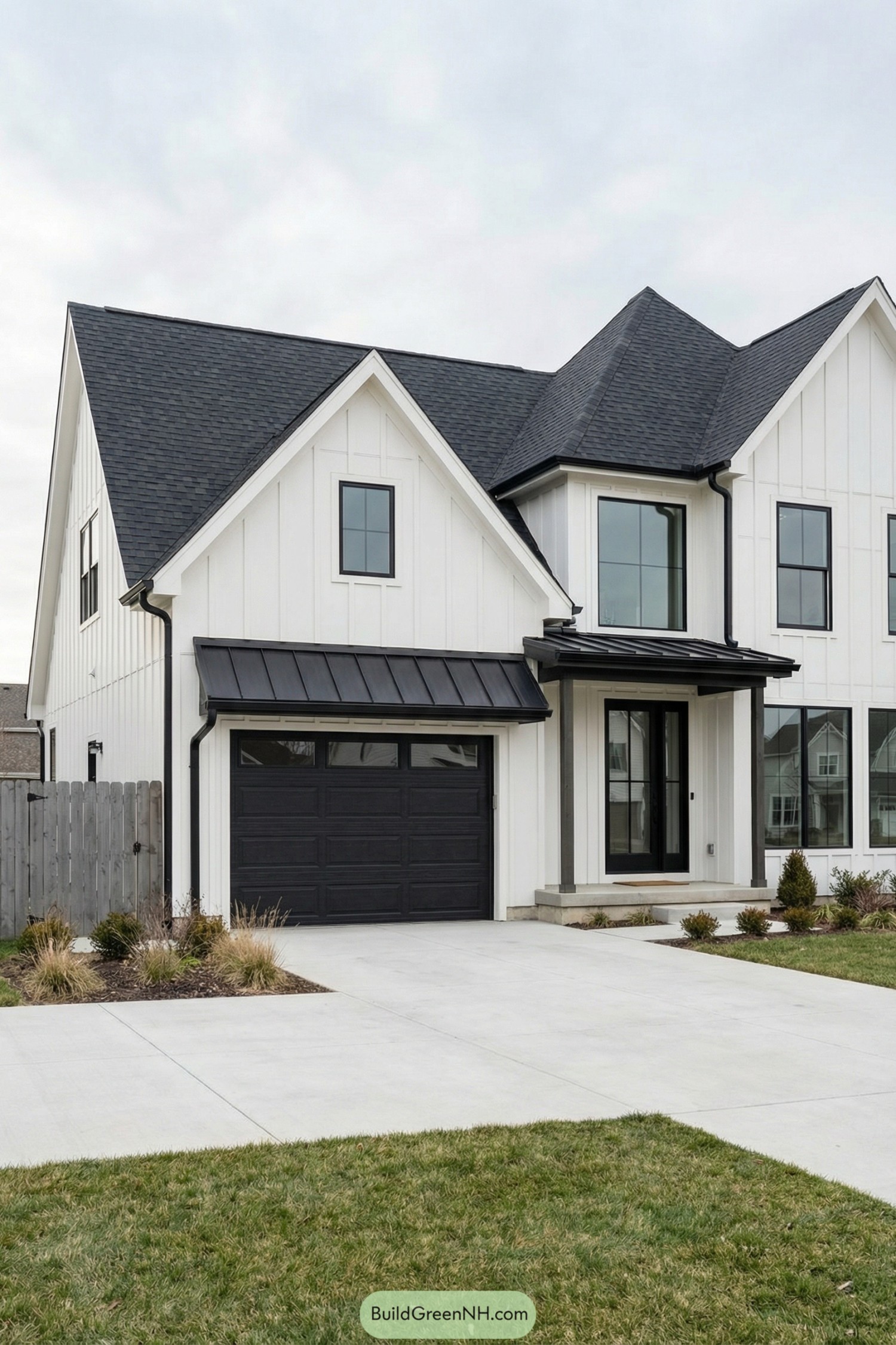 White modern farmhouse with black framed windows and black garage door