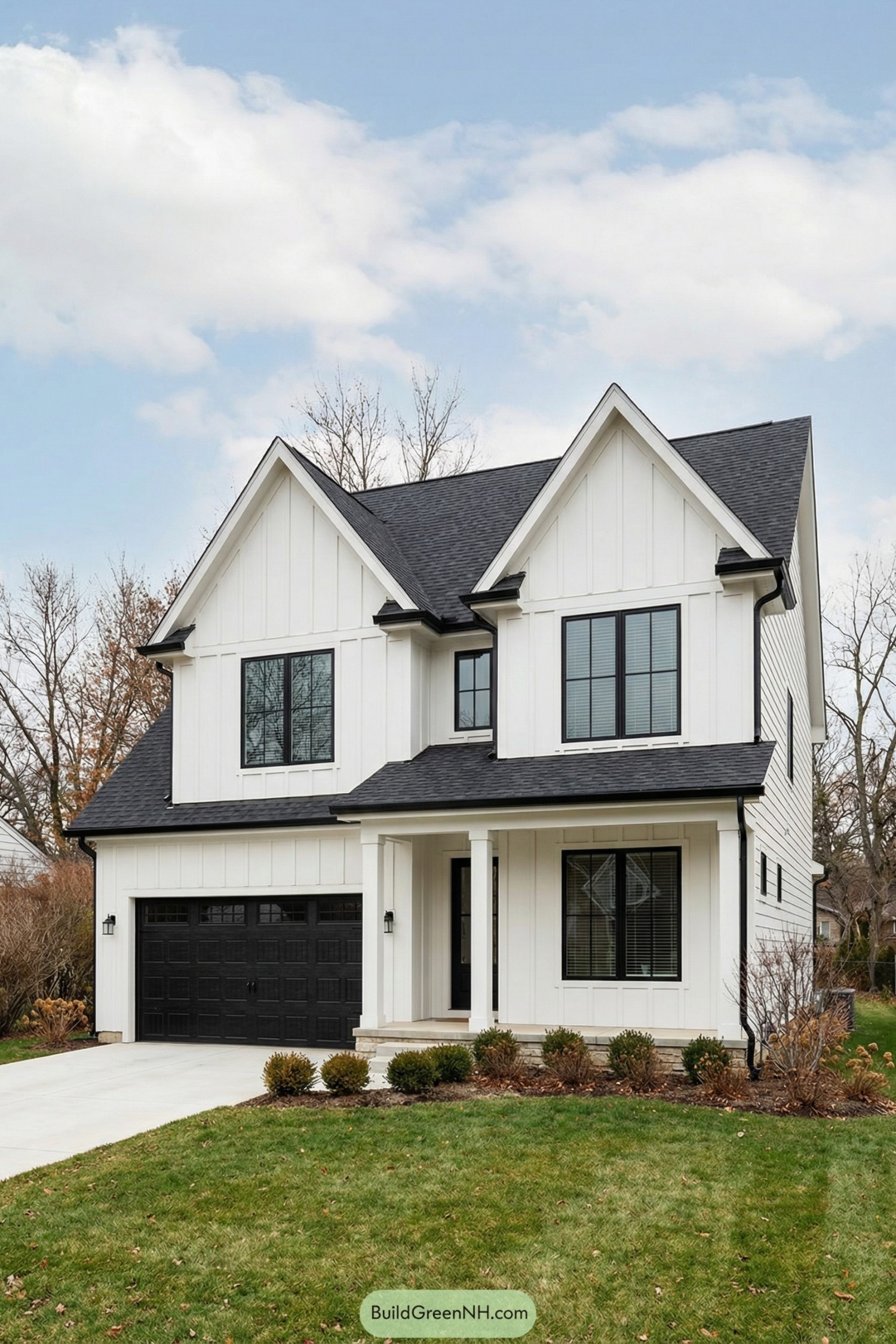 White two story house with black windows and black garage door