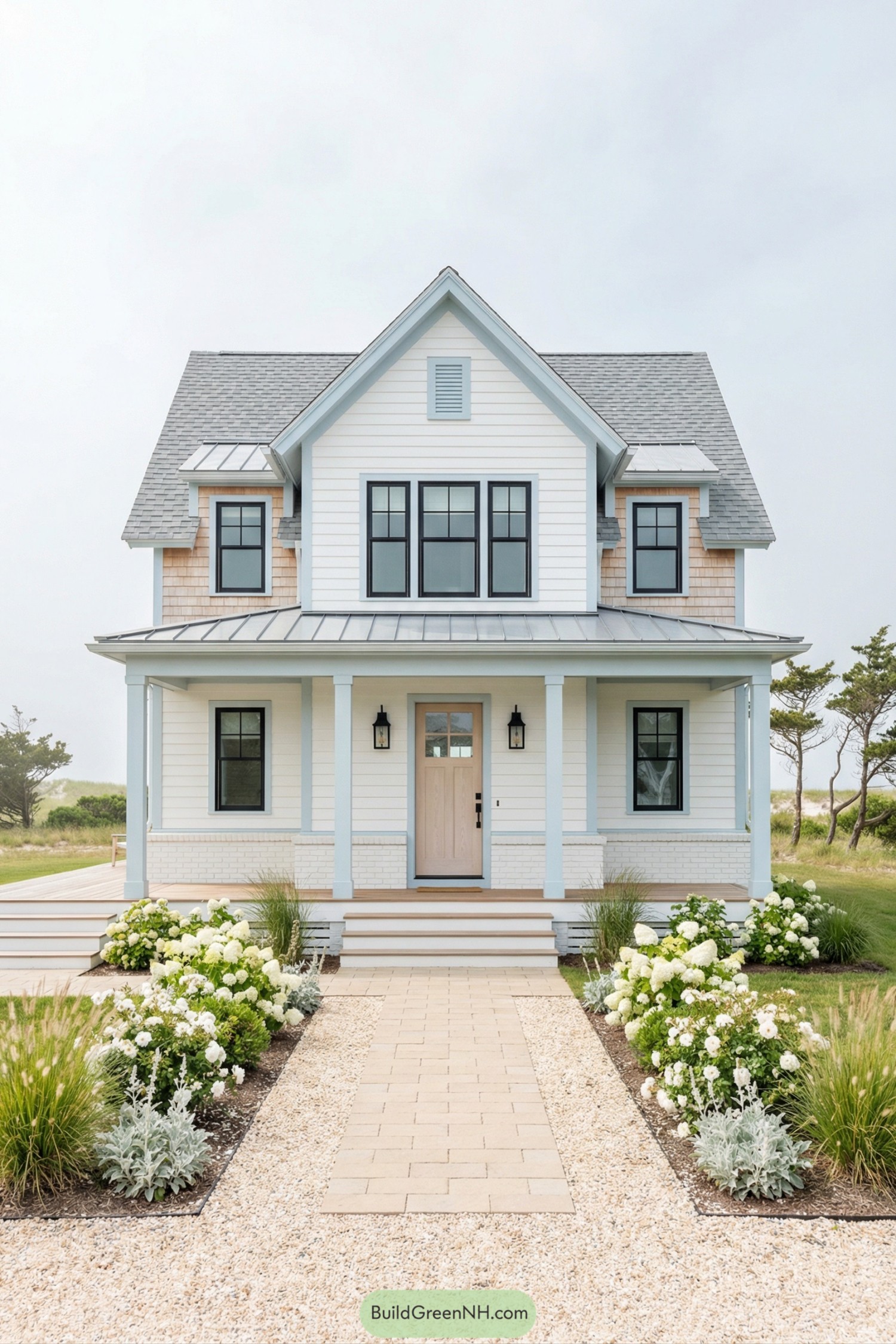 Light blue trimmed cottage with front porch and coastal garden path