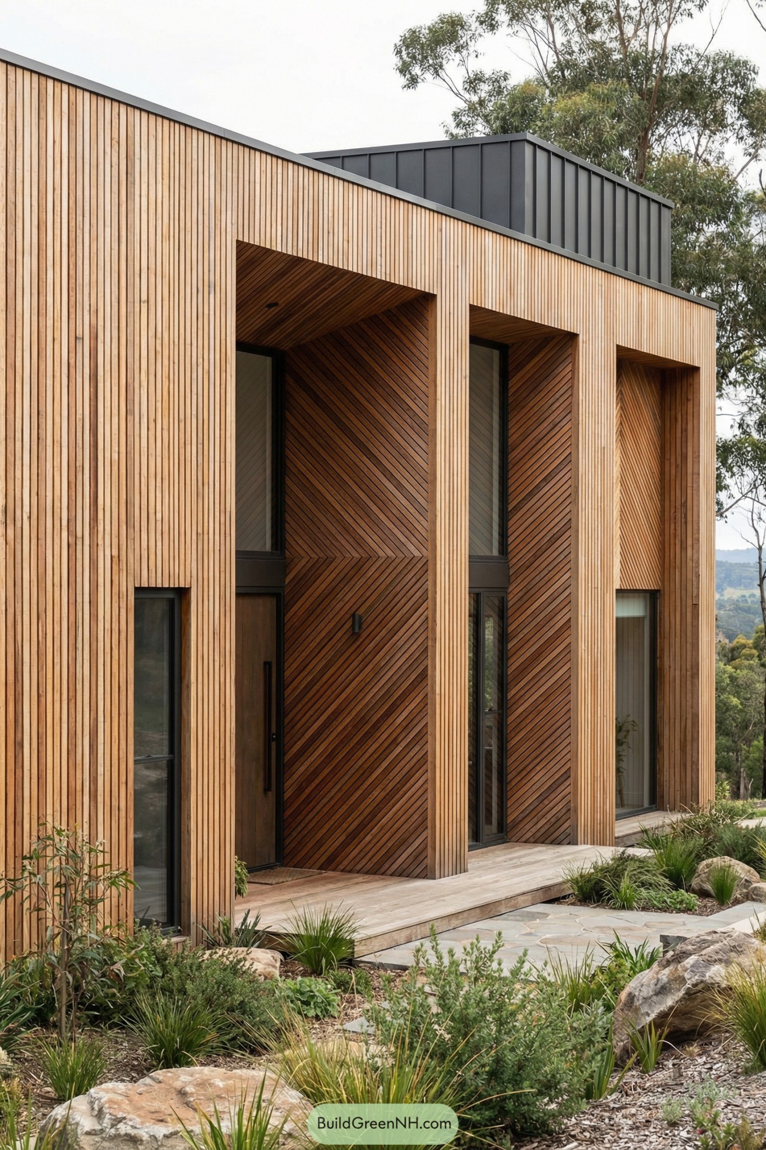 Modern house with vertical and diagonal wooden slat facade surrounded by low native landscaping