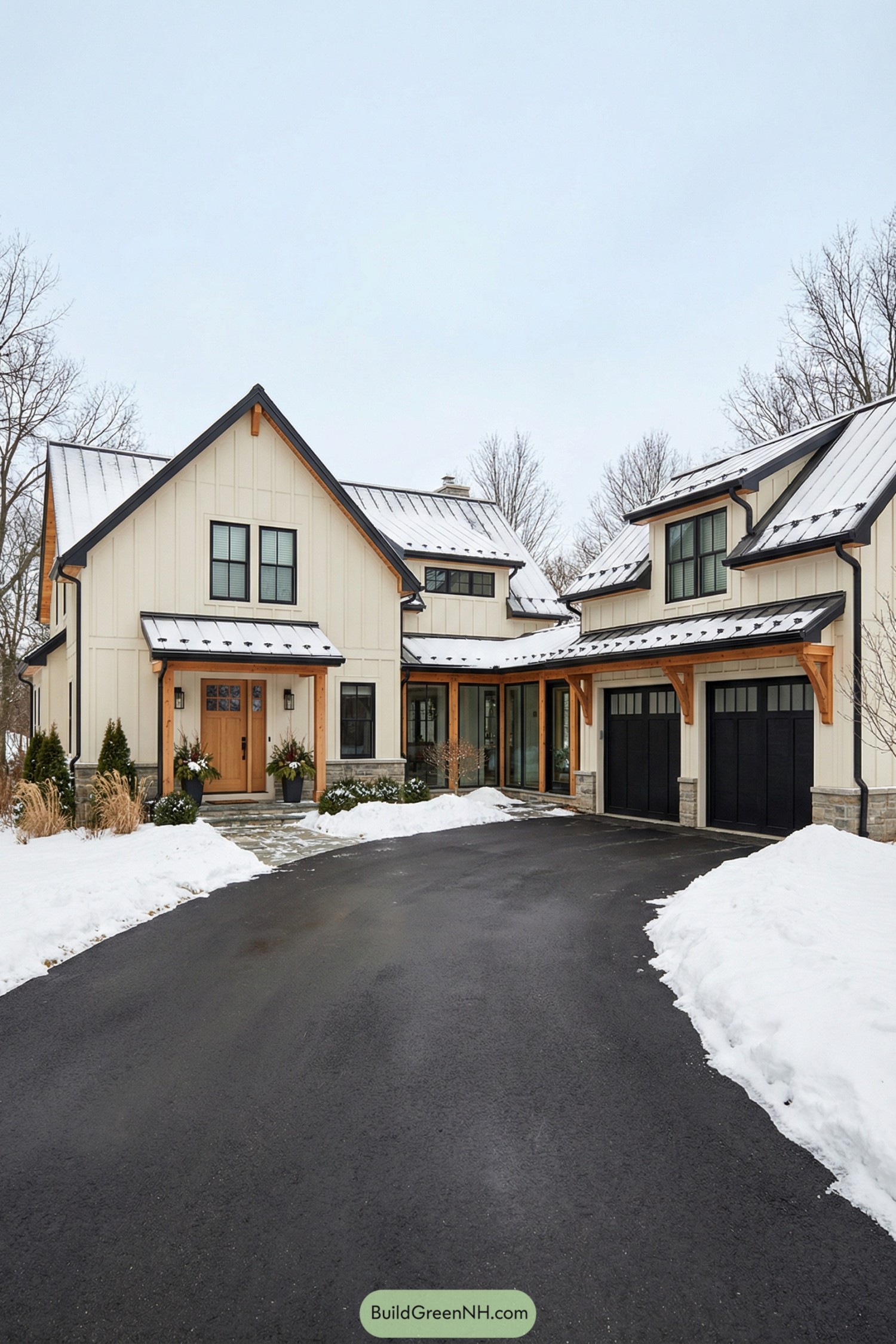 Cream board-and-batten house with breezeway garage in winter