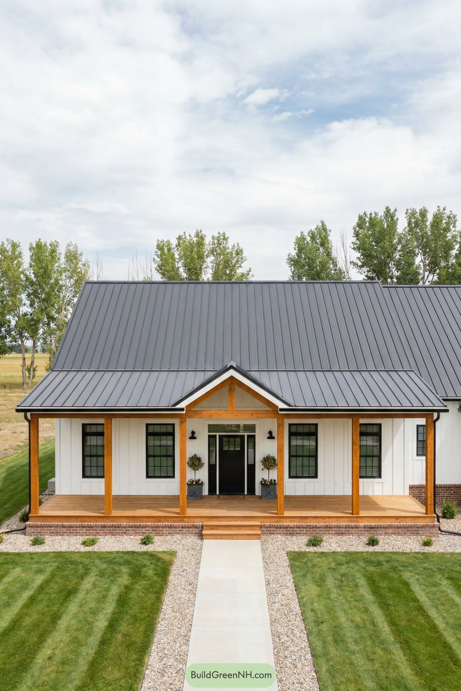 Modern white barndominium with wood porch