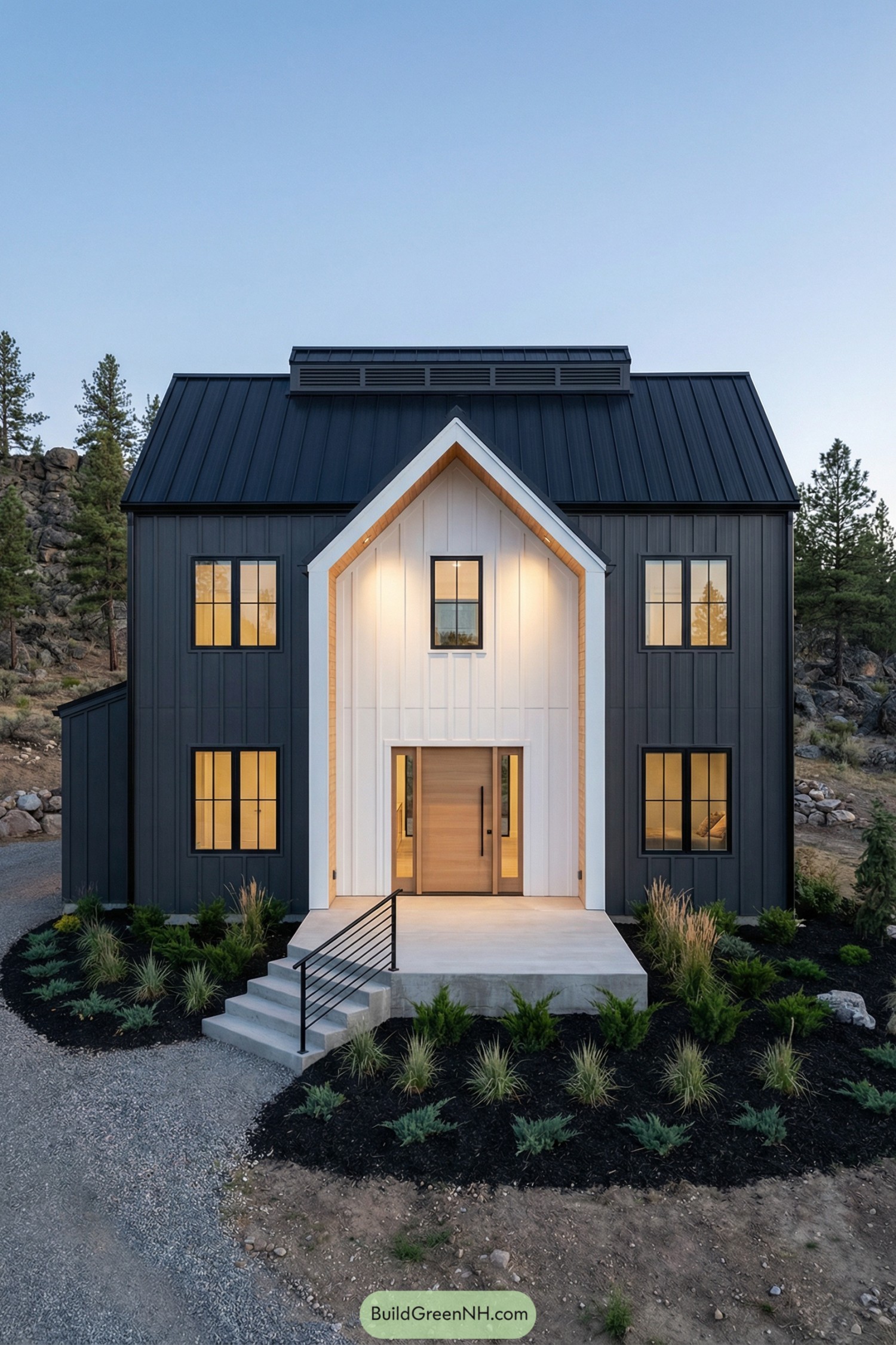Modern black metal barndominium with bright gabled entry
