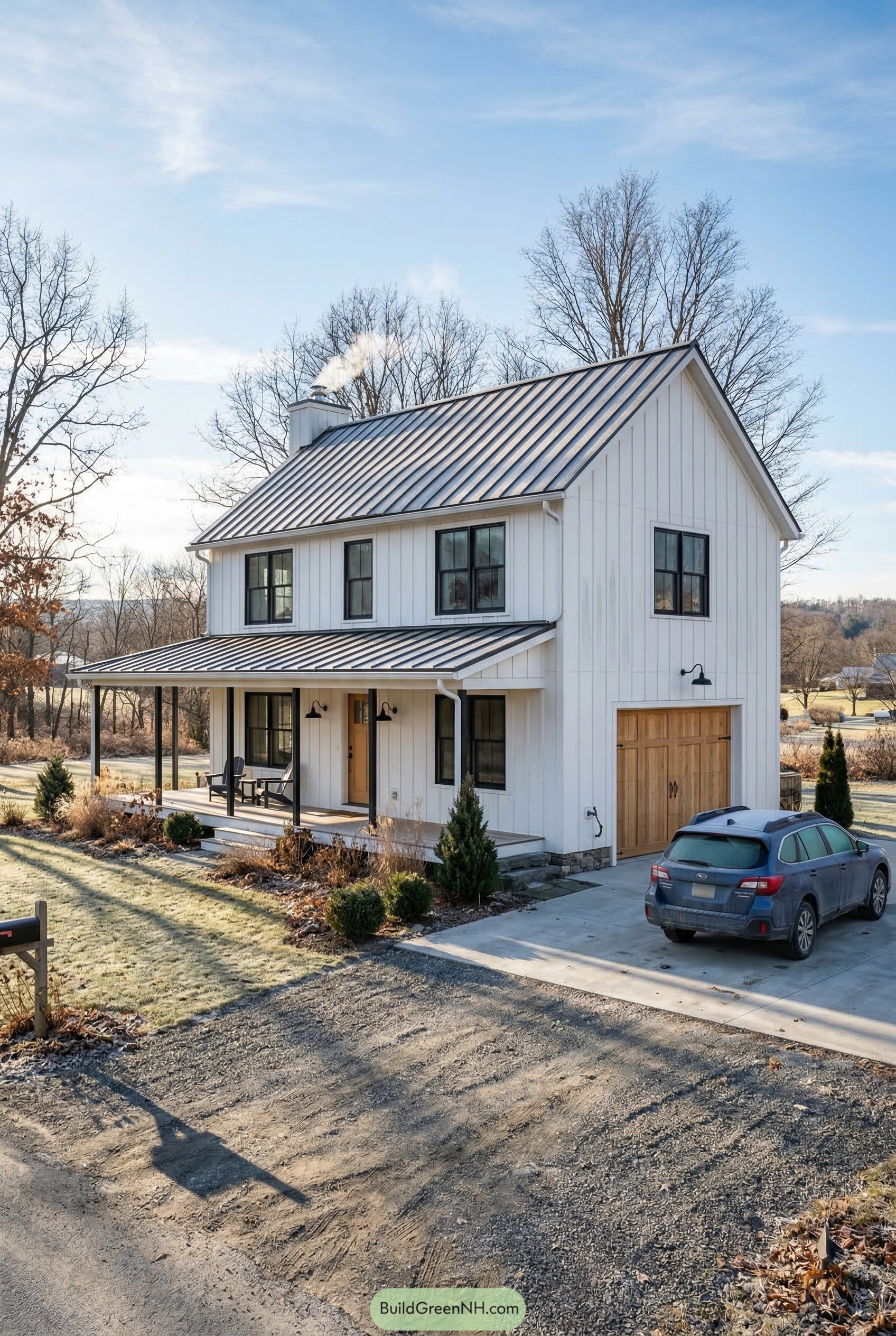 White barn style garage house with porch