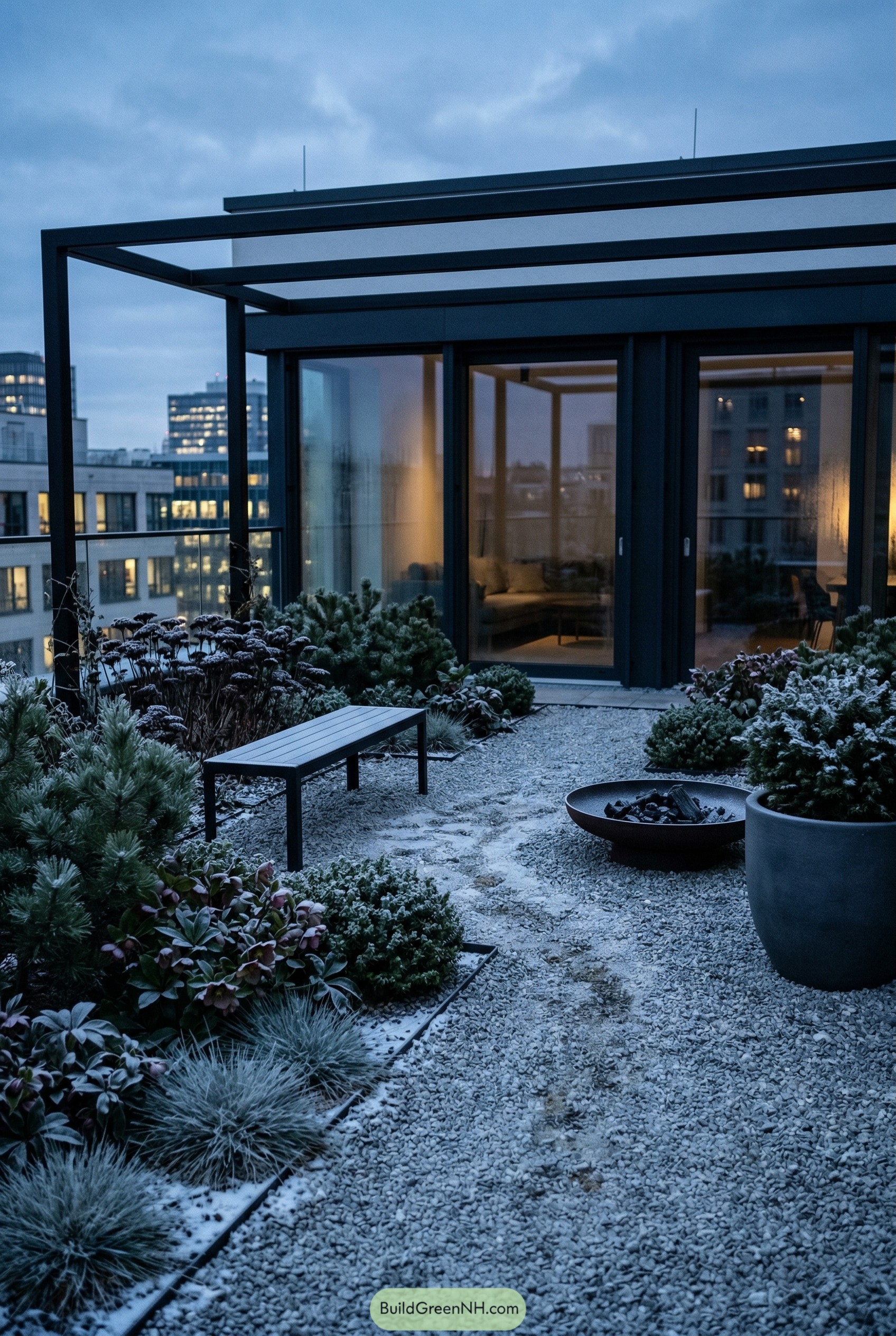Modern rooftop gravel garden with bench and fire bowl