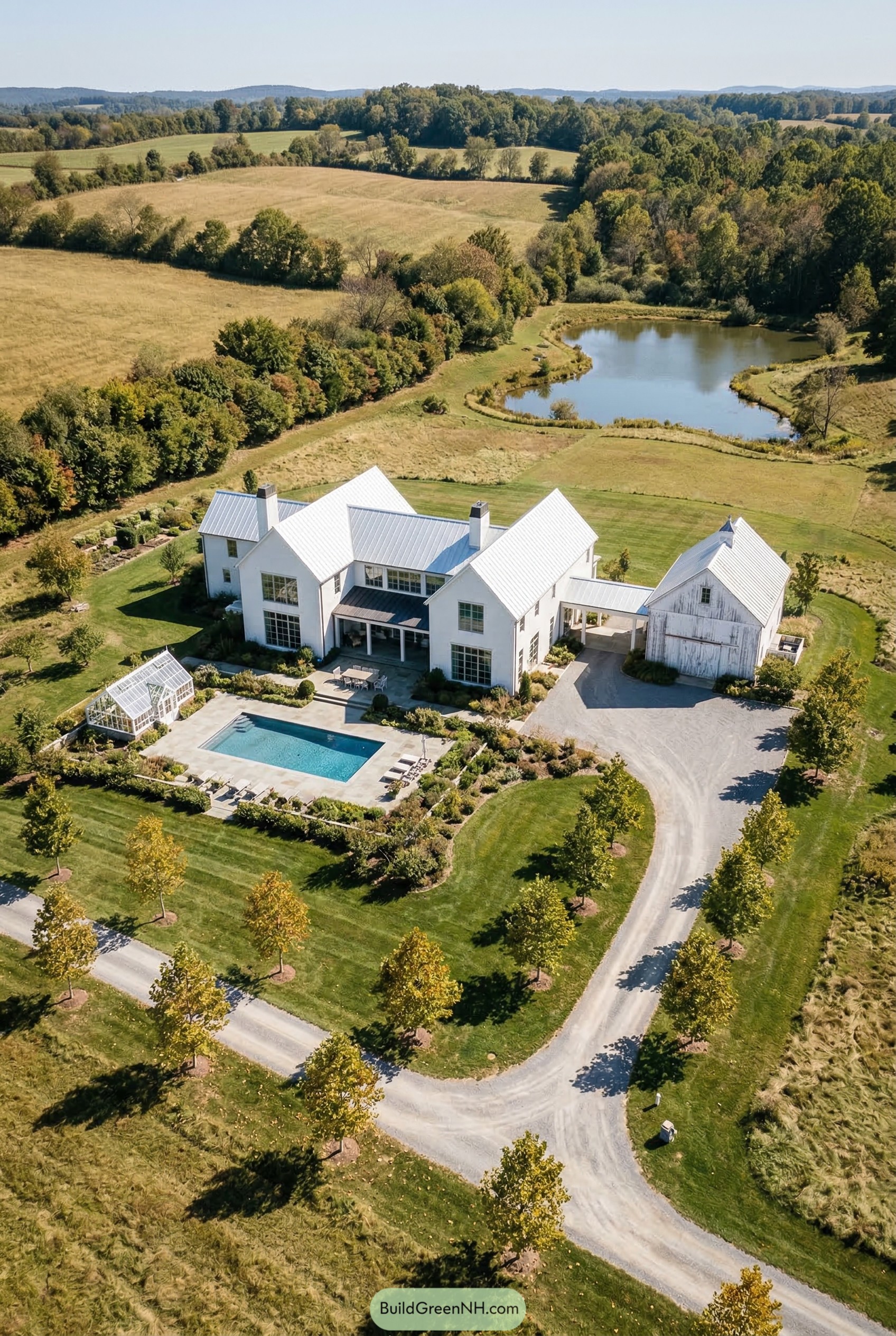White farmhouse compound with pool and barn