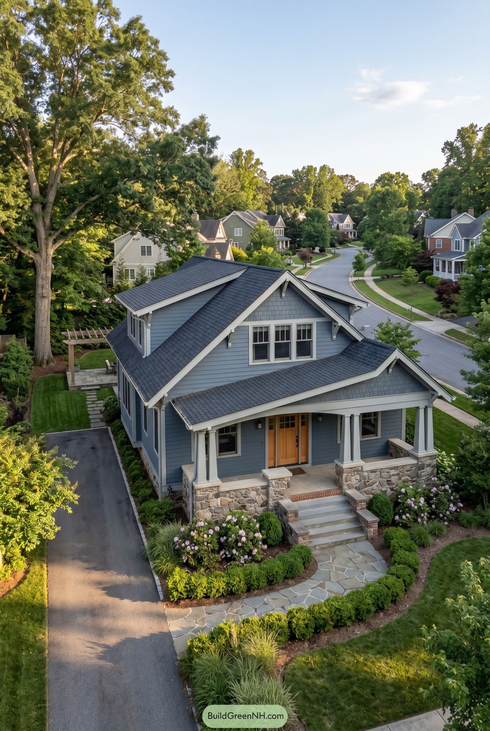 Blue craftsman home with stone porch