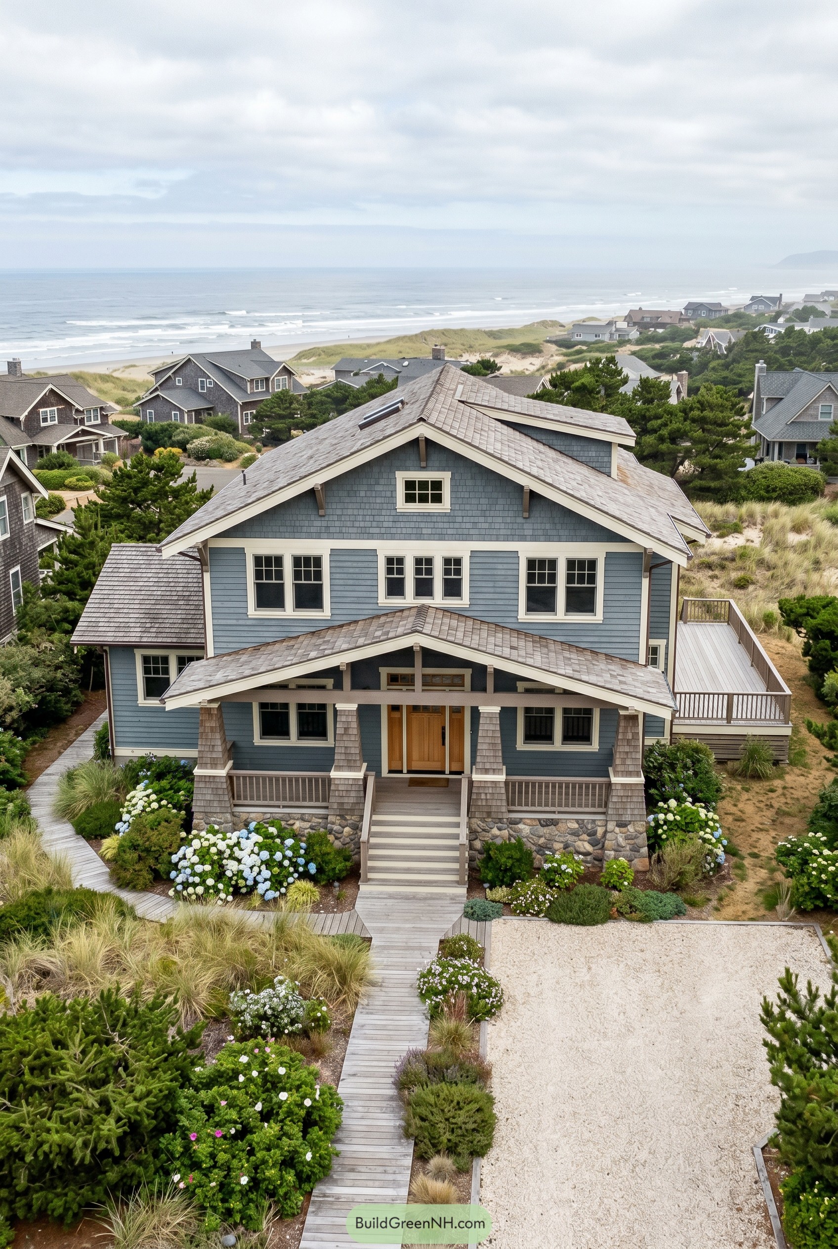 Blue coastal craftsman with stone porch base