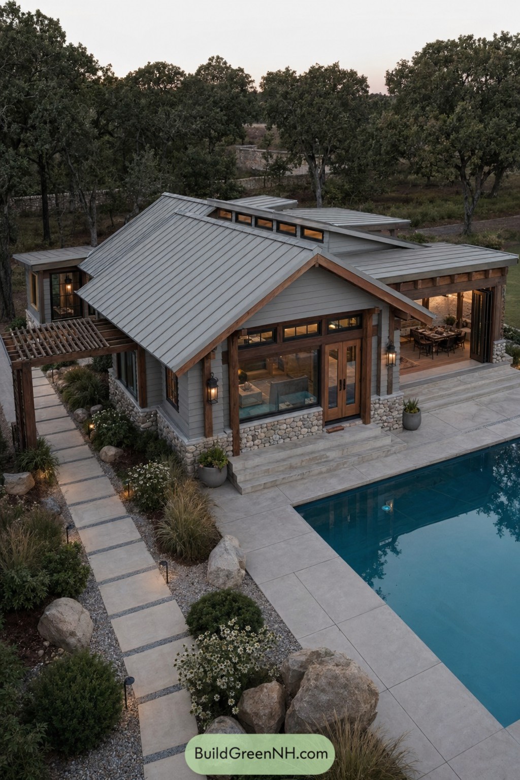 Modern craftsman pool house with metal roof beside a rectangular pool