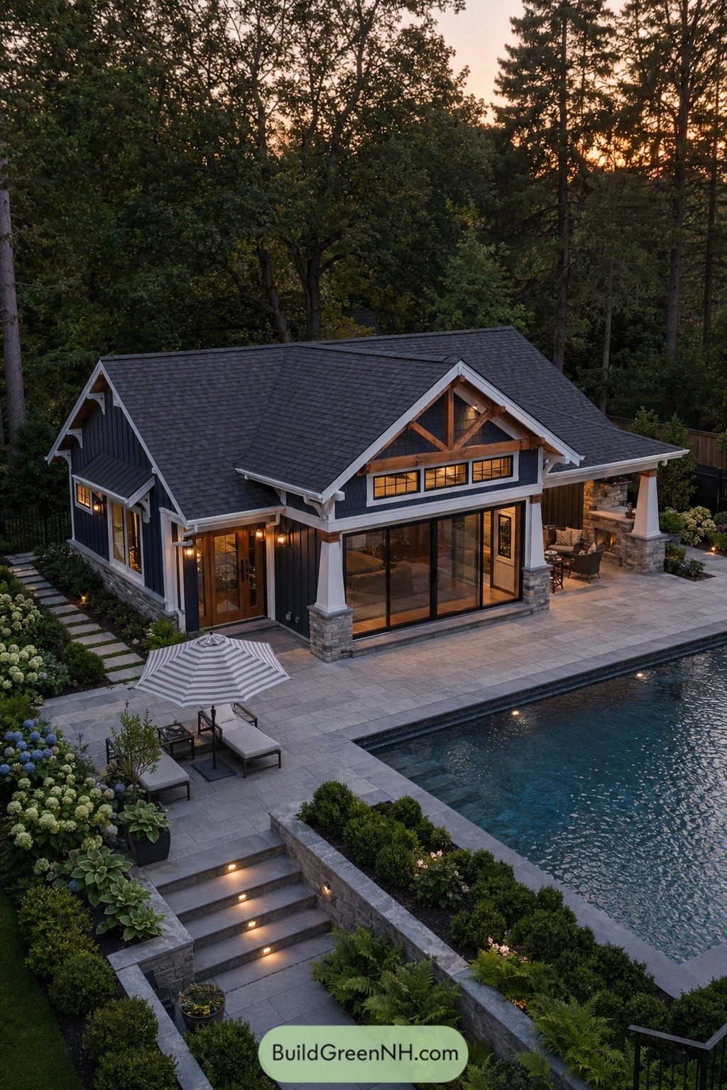 Dark craftsman pool house beside a pool
