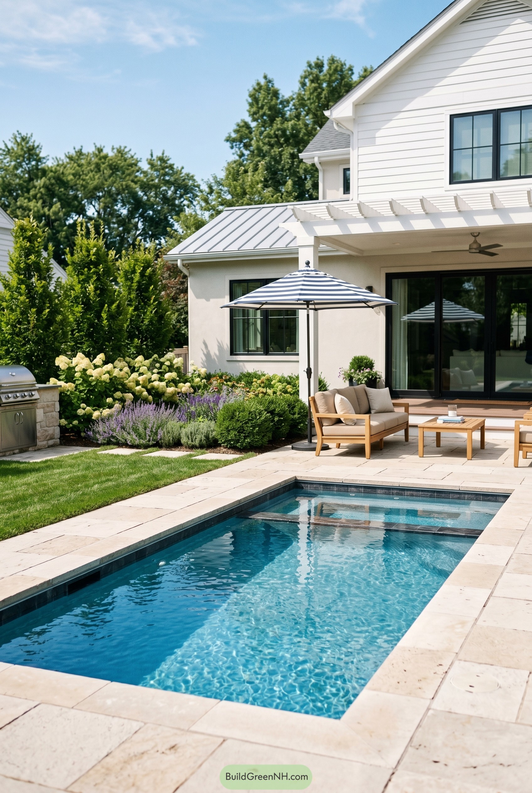 Modern backyard plunge pool with patio seating and hydrangeas