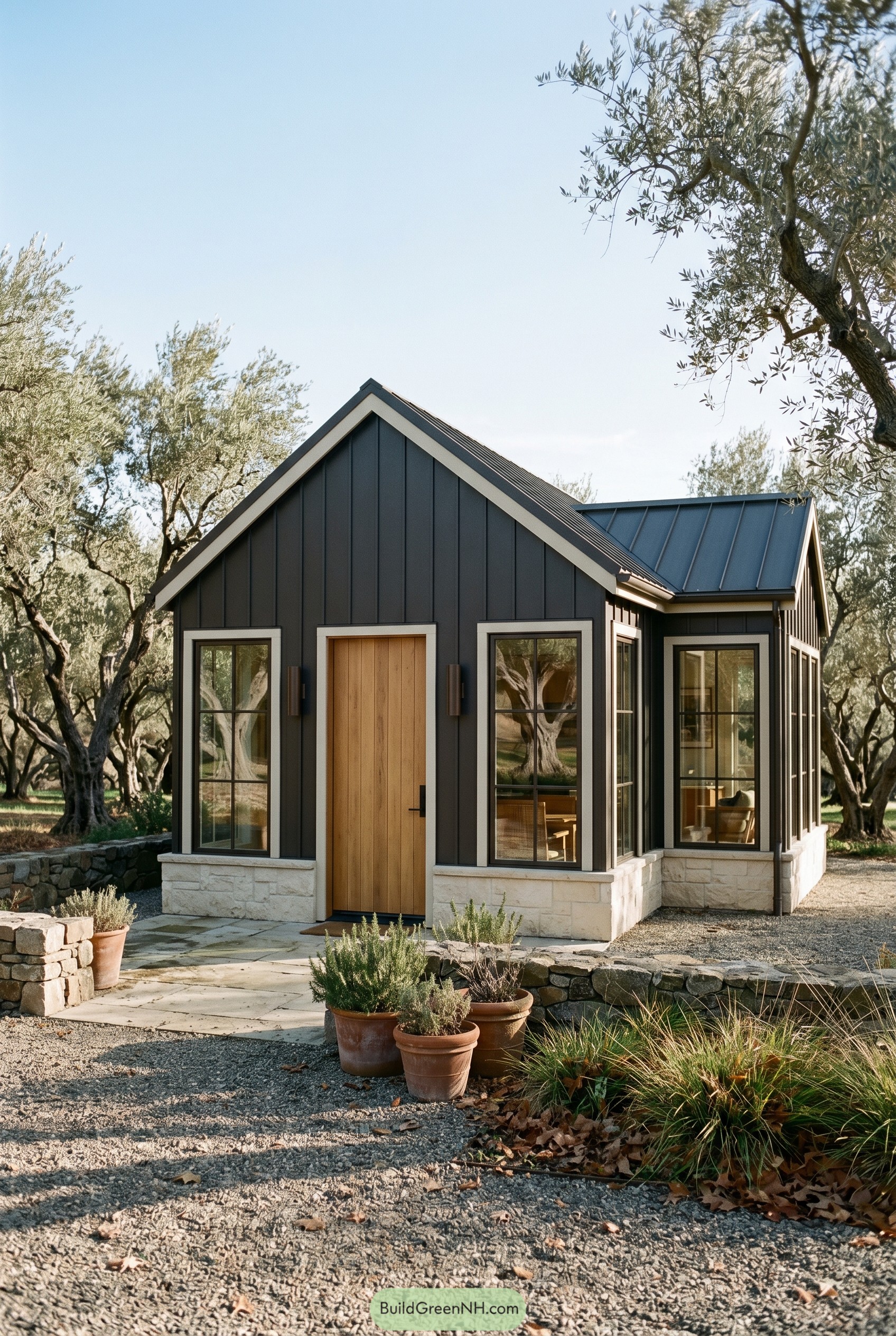 Dark bronze gabled cottage with wood door