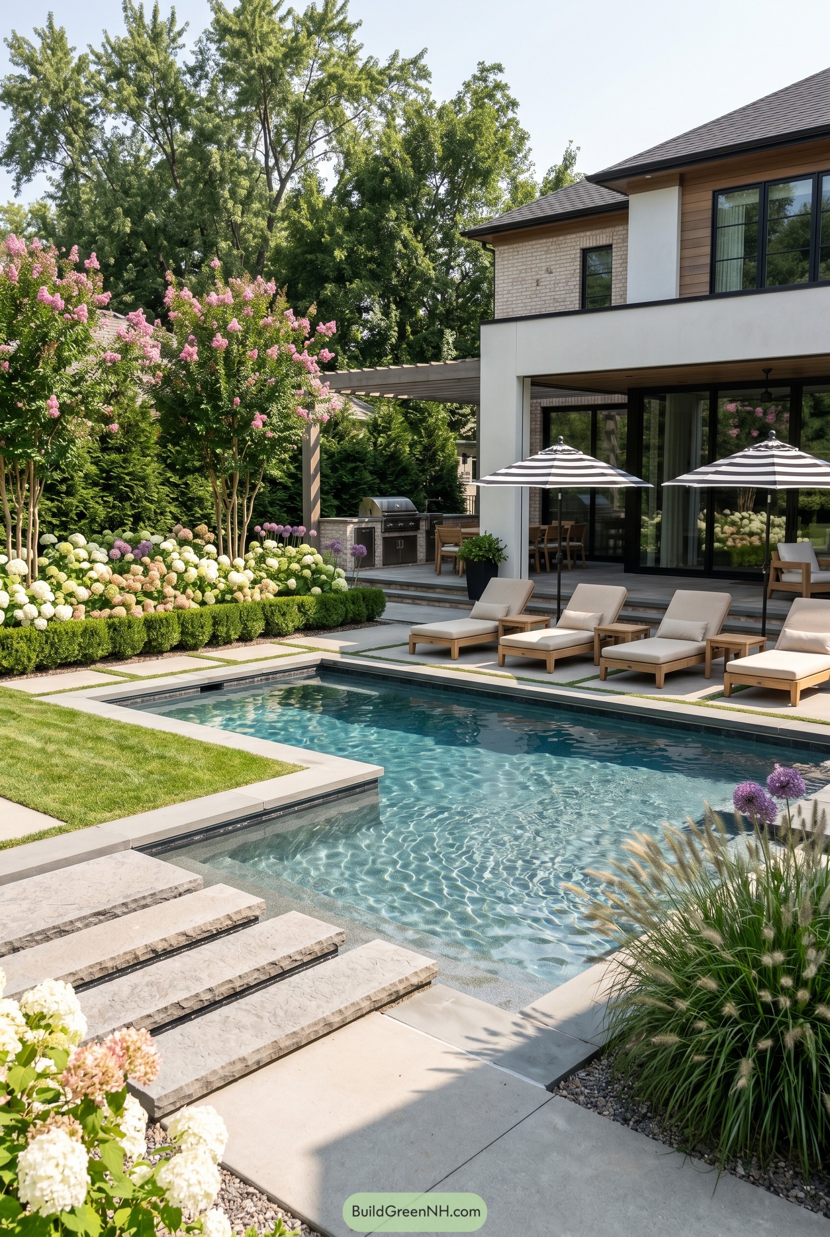 Modern pool with flowering resort garden