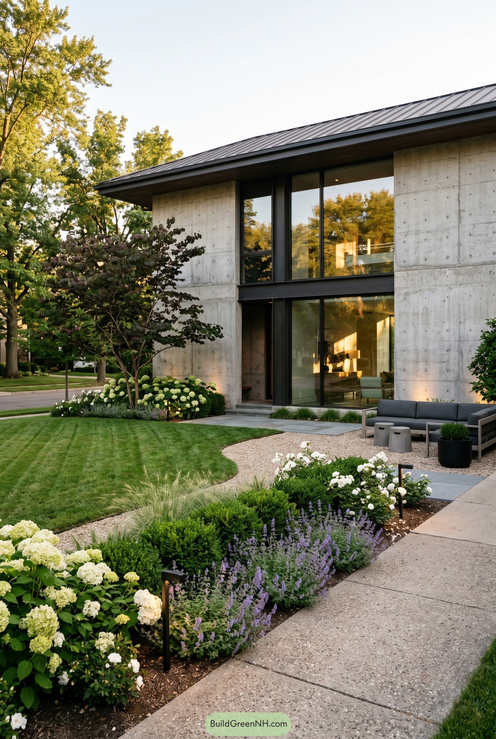 Brutalist concrete home with curved gravel garden