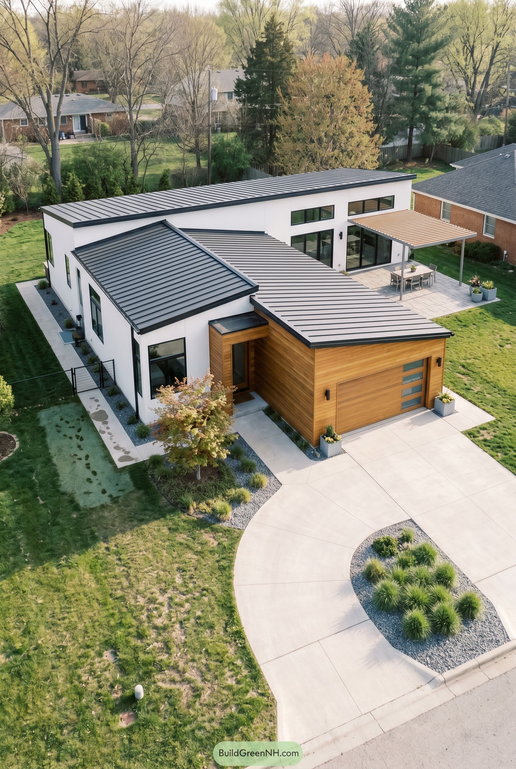 Modern one story house with wood garage and metal roof