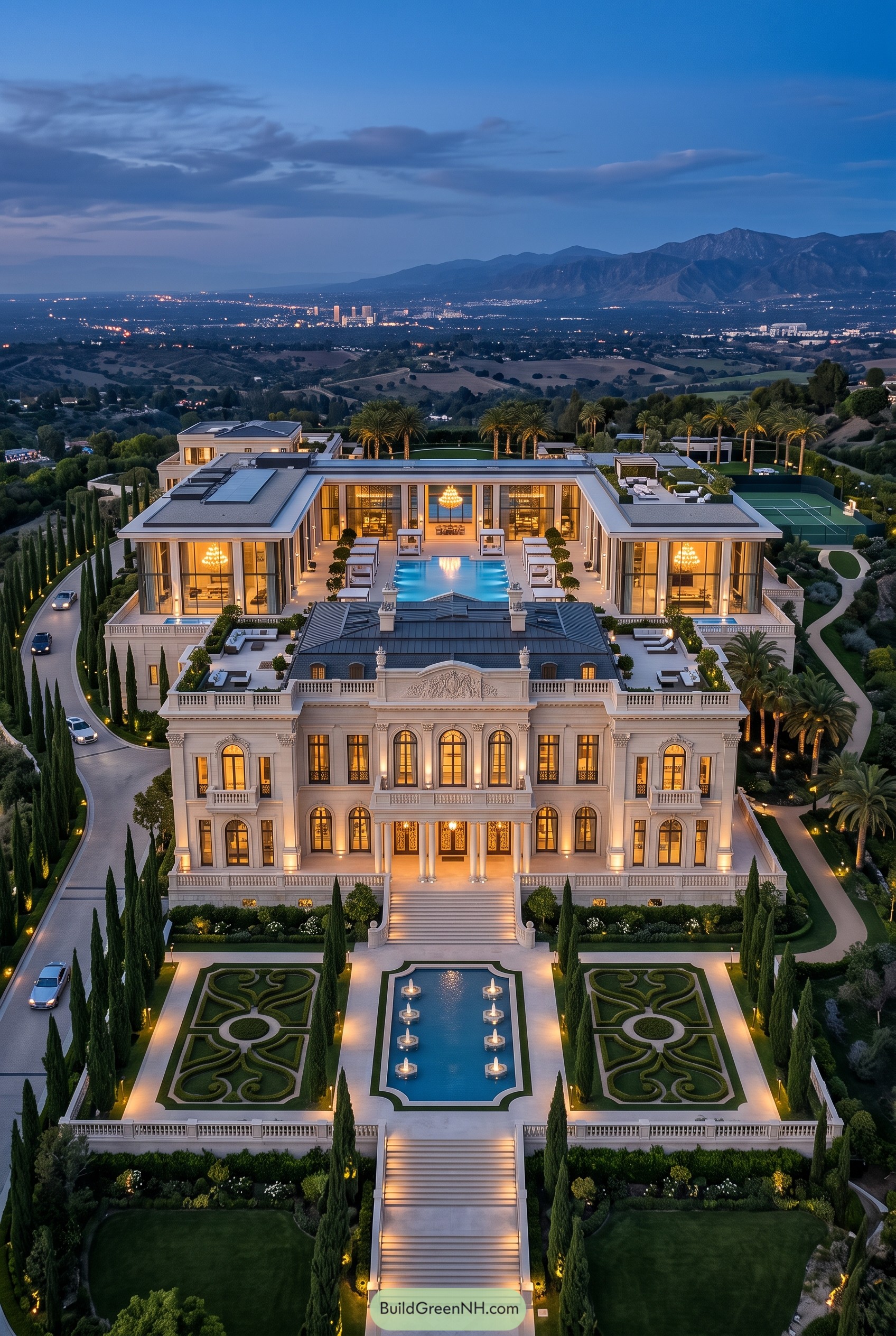 Aerial view of a grand mansion with formal gardens