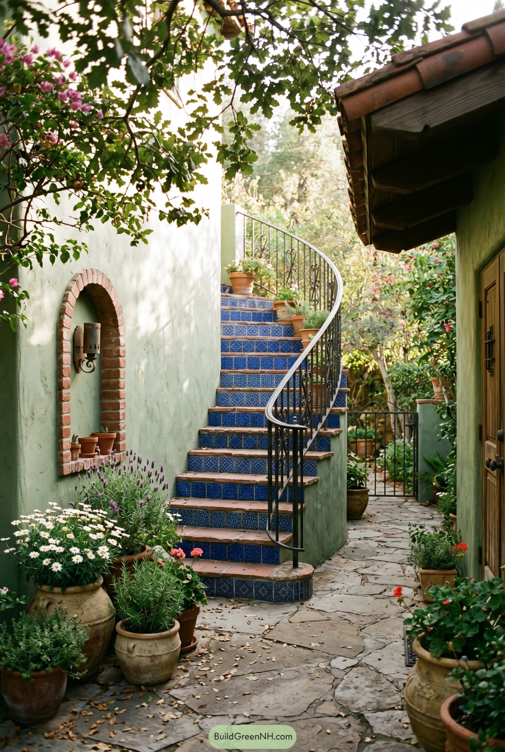 Blue tiled courtyard staircase with potted plants