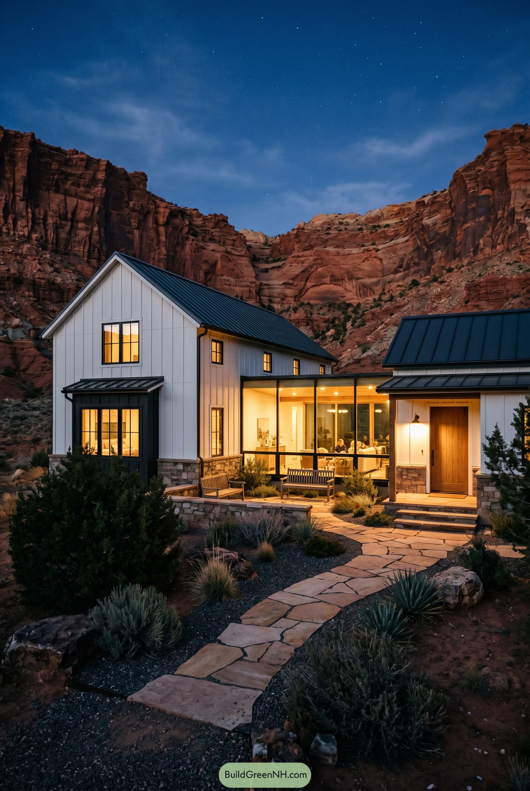 White farmhouse with glass breezeway in a red rock canyon