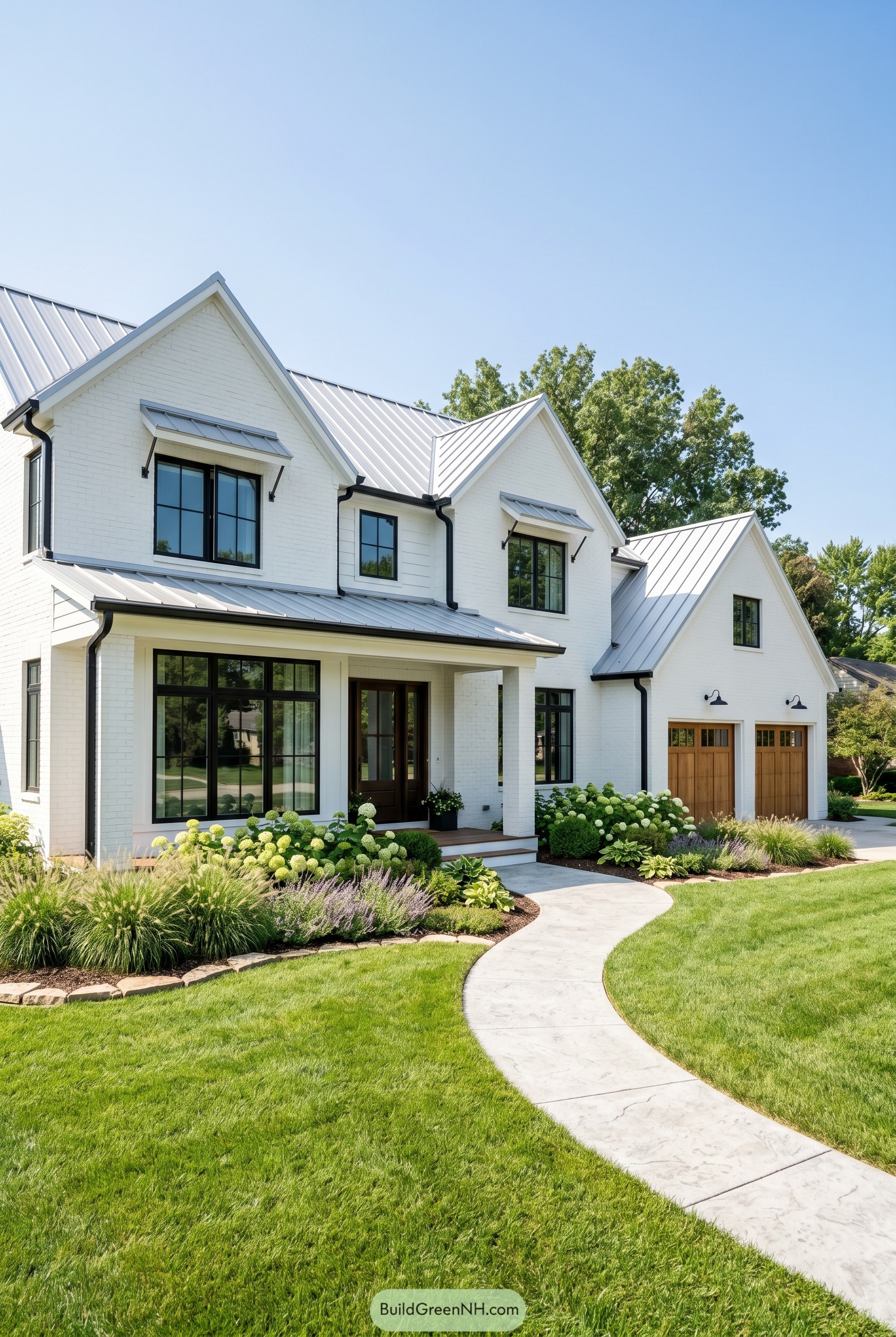 White brick farmhouse with metal roof and curved path