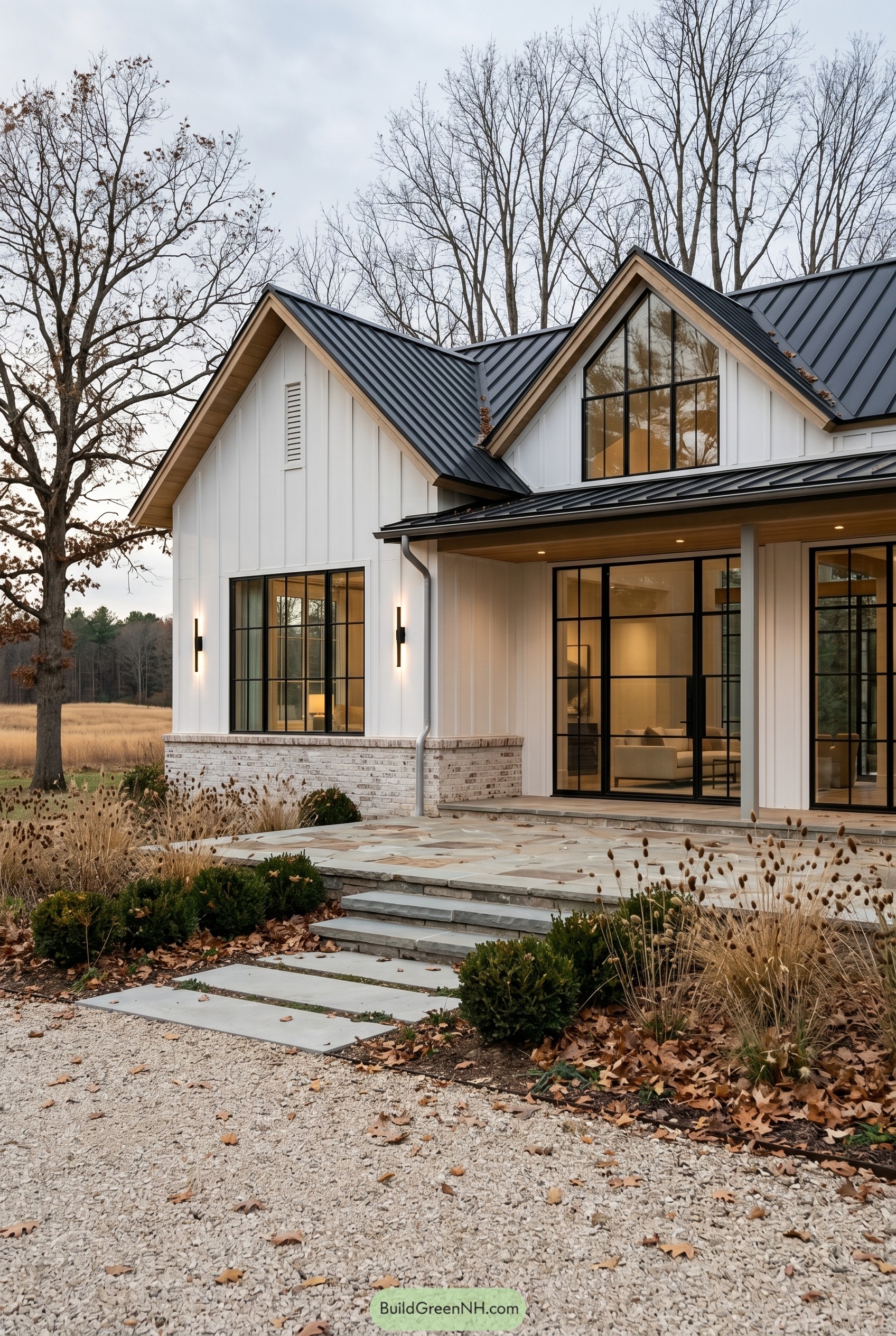 White modern farmhouse with black metal roof
