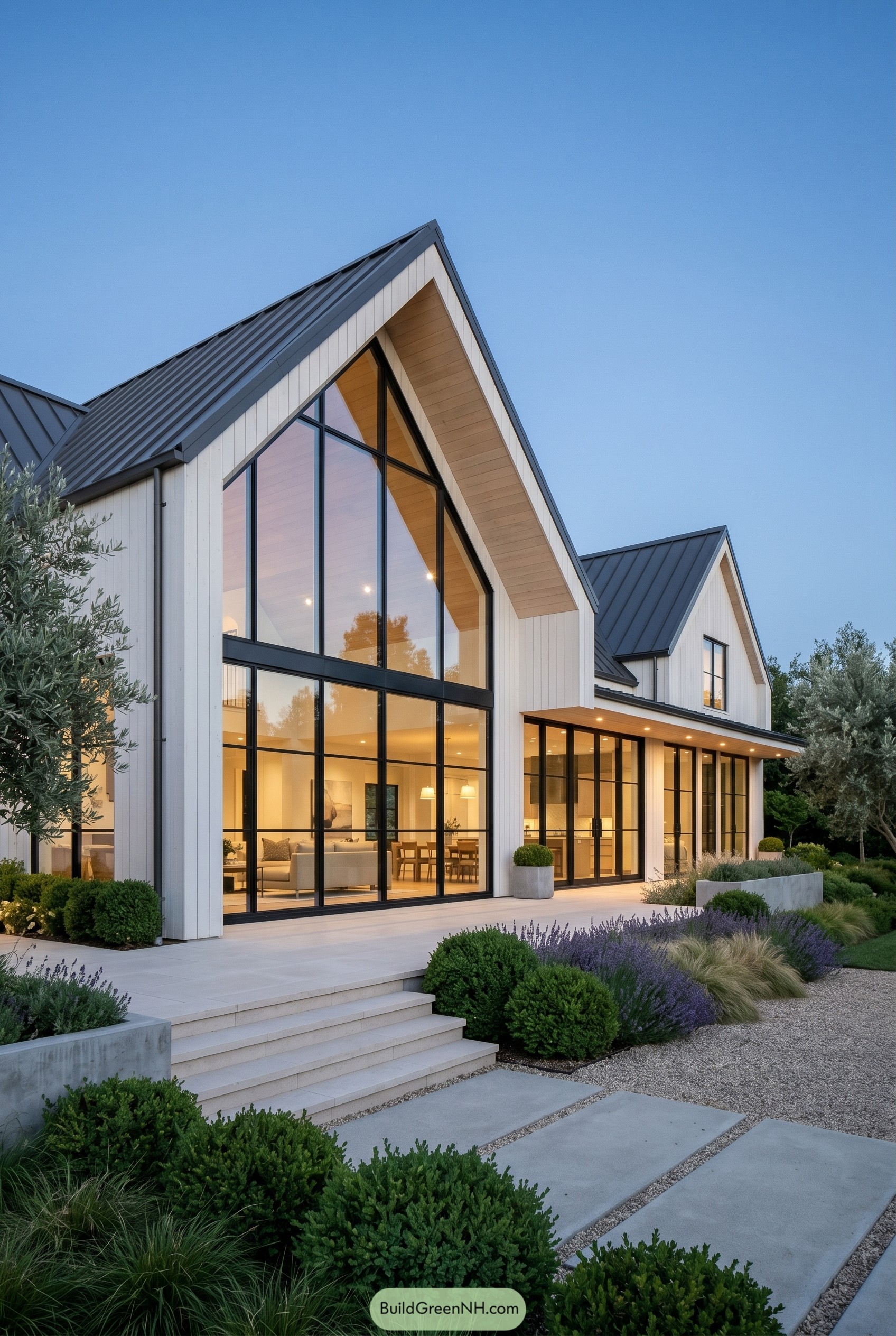 Modern white farmhouse with soaring glass gable