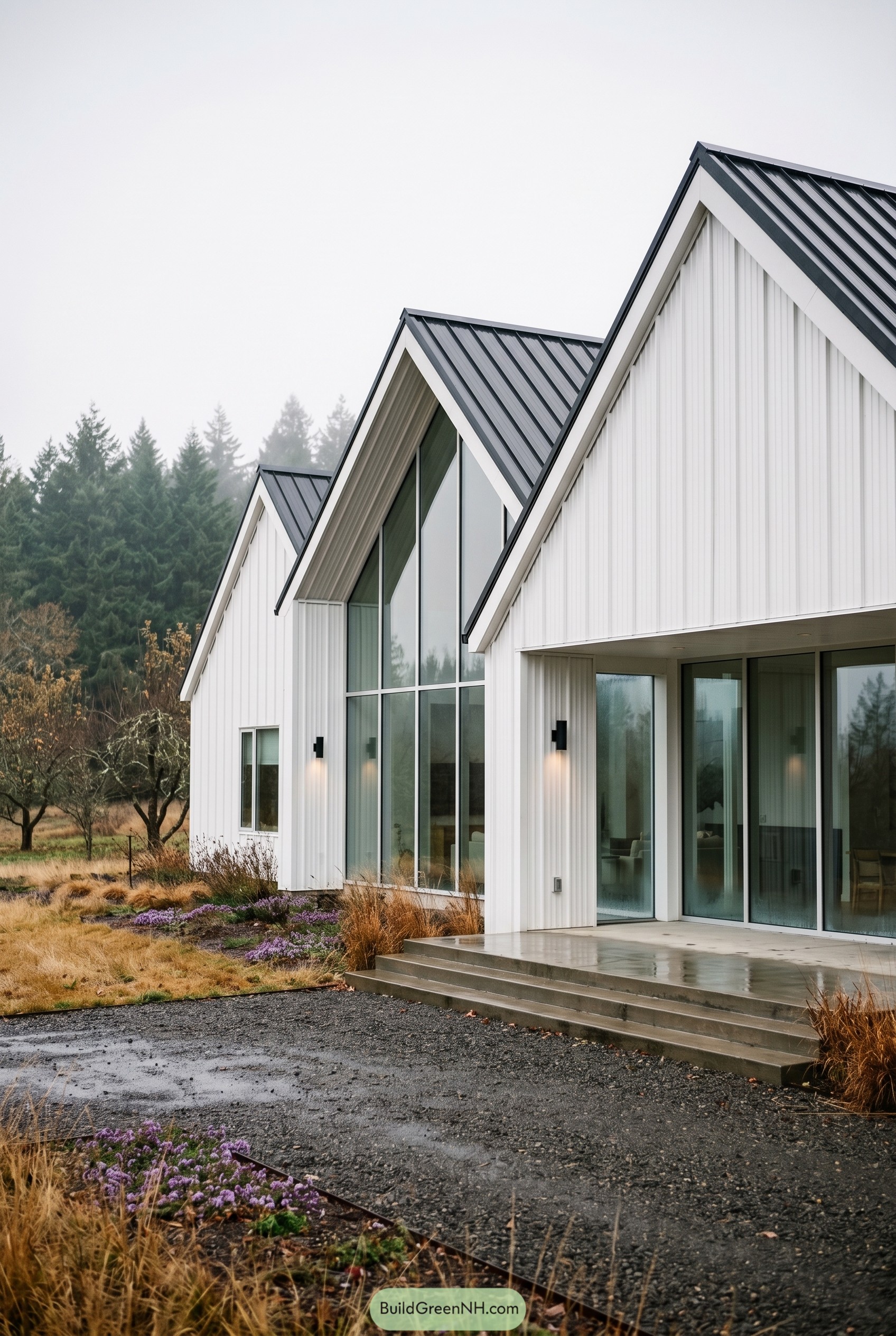 White modern farmhouse with black gabled roofs