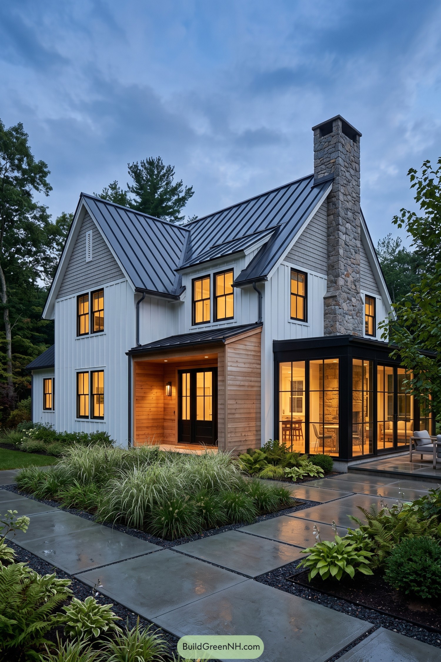 Modern Cape Cod home with a stone chimney and glass sunroom