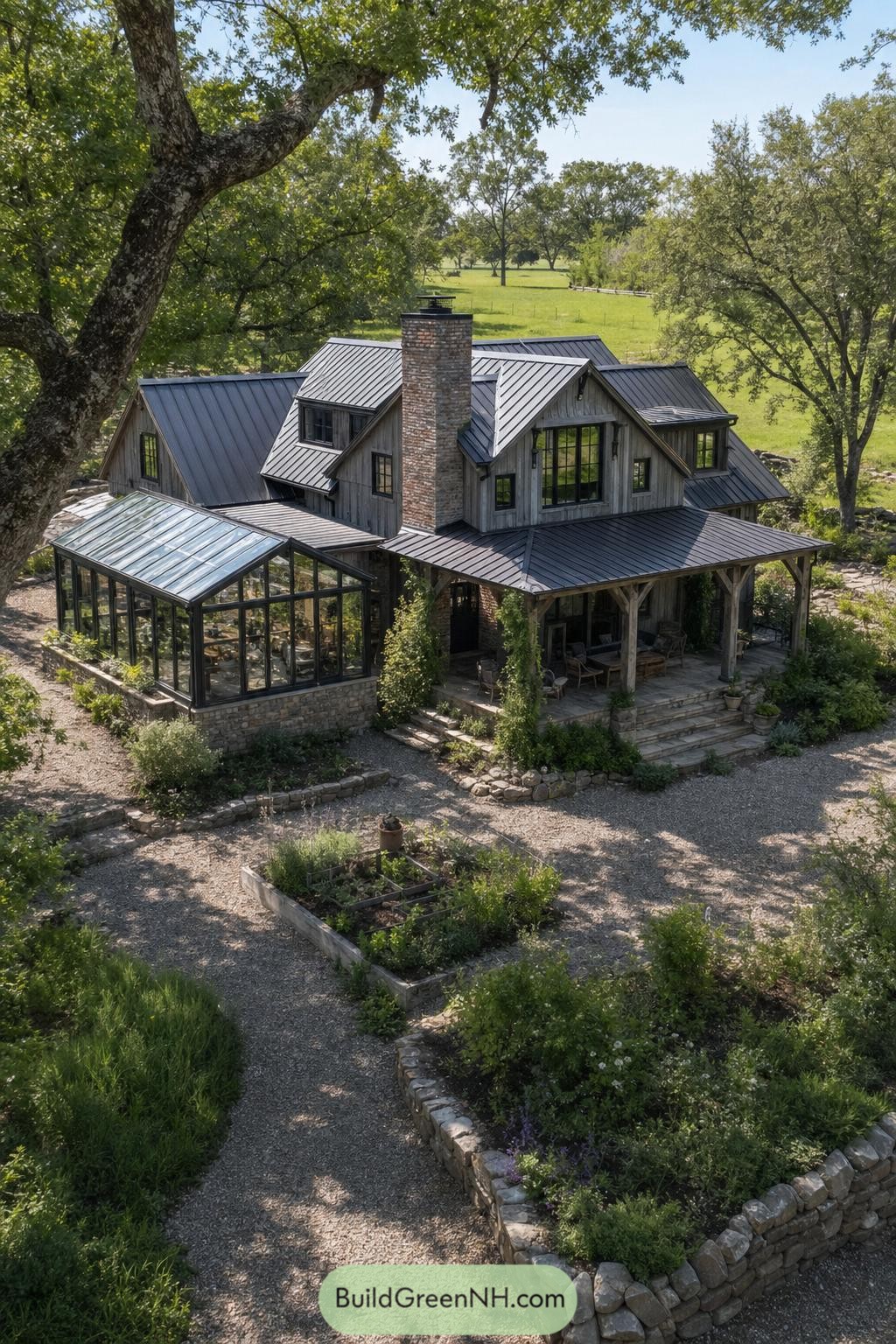 Weathered timber barndominium with a glass conservatory and brick chimney beneath mature trees