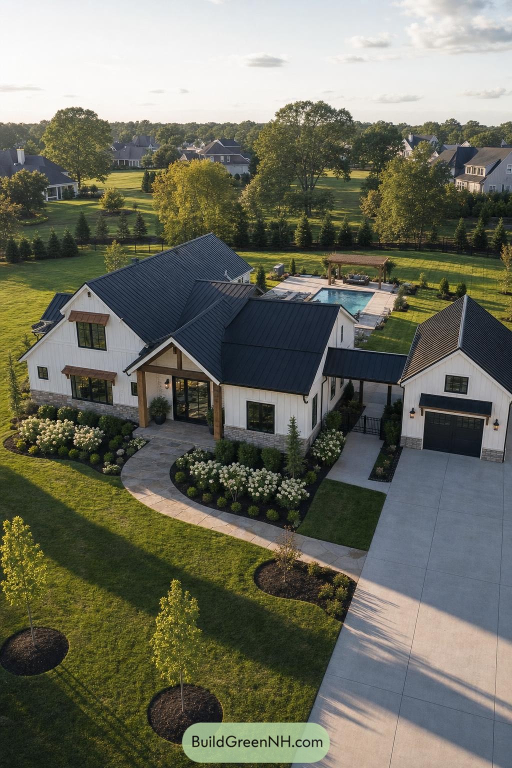 White Barndominium With Black Roof And Pool Courtyard
