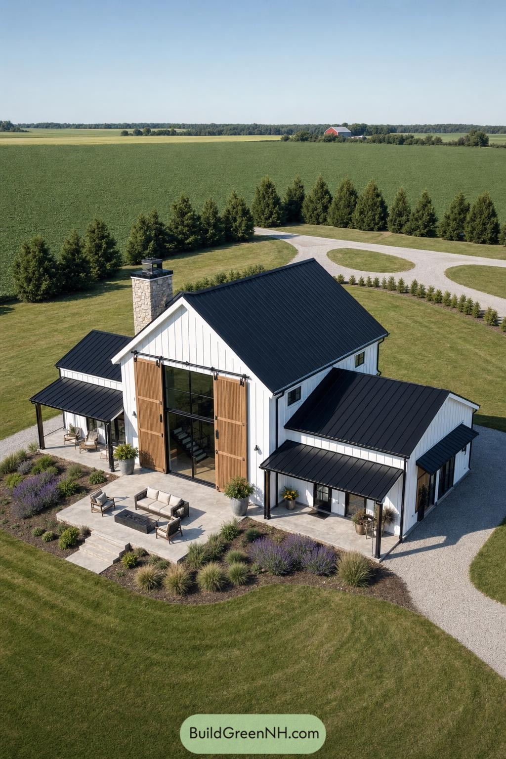 White barndominium with cedar doors and black roof