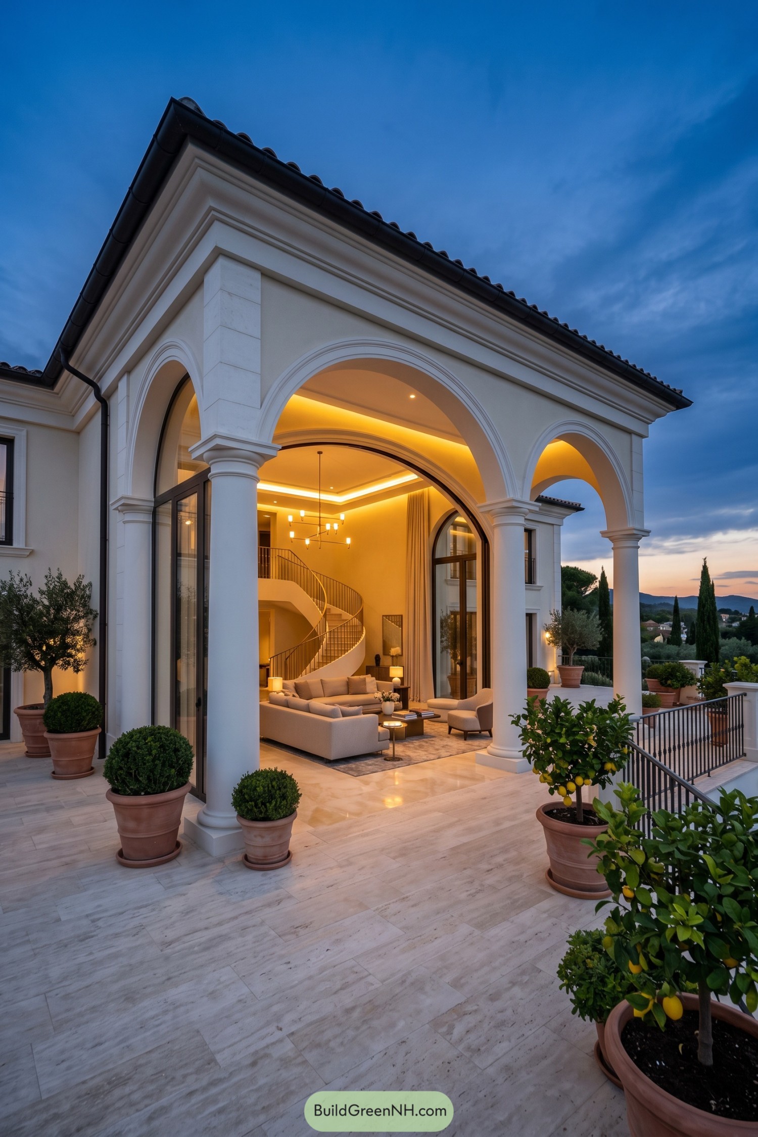 Arched white villa with a glowing lounge and lemon trees