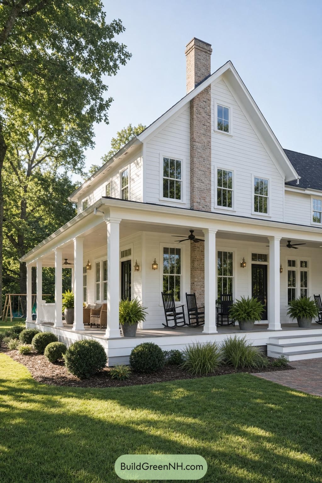 White farmhouse with wraparound porch and brick chimney