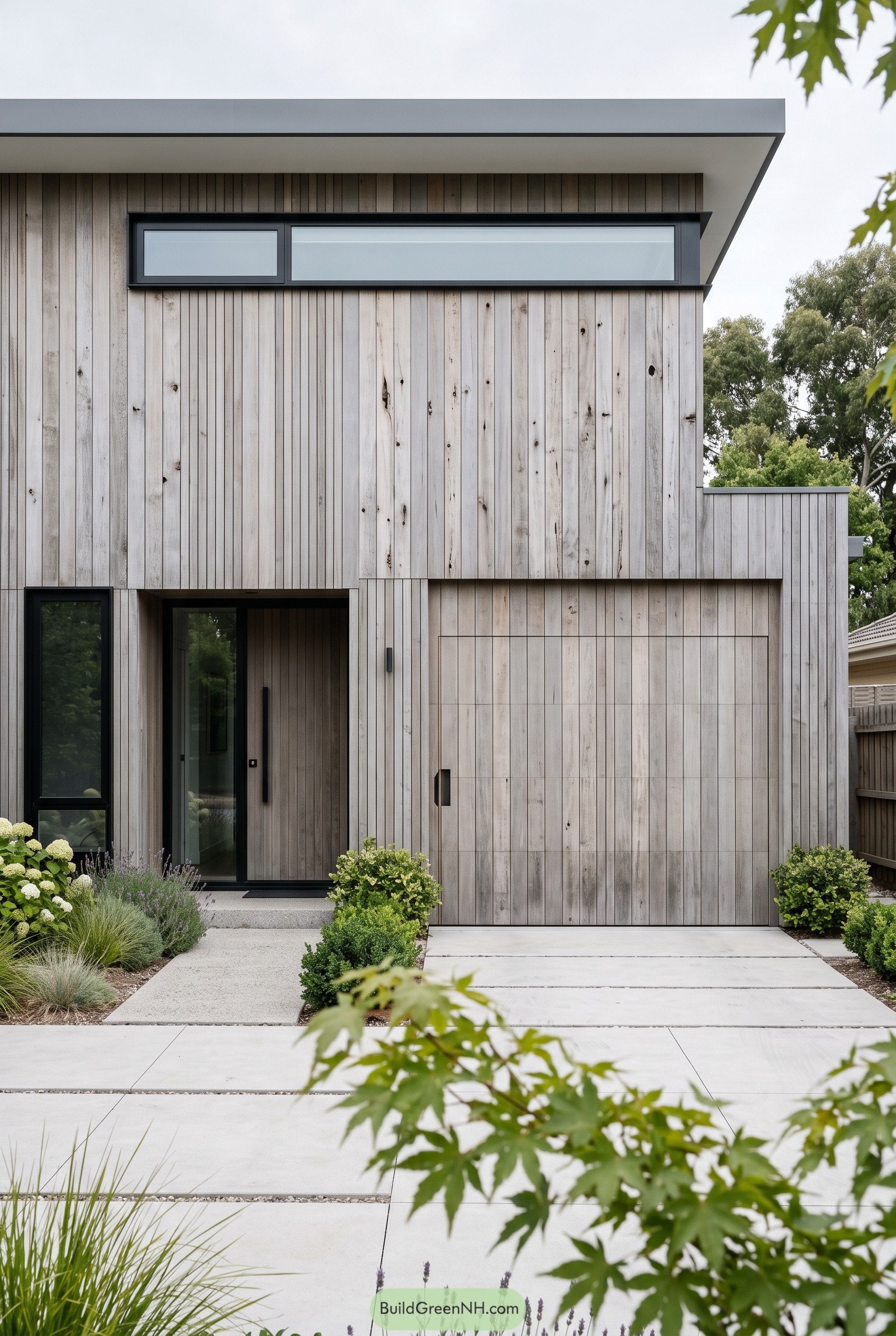 Modern house with grey vertical wood cladding