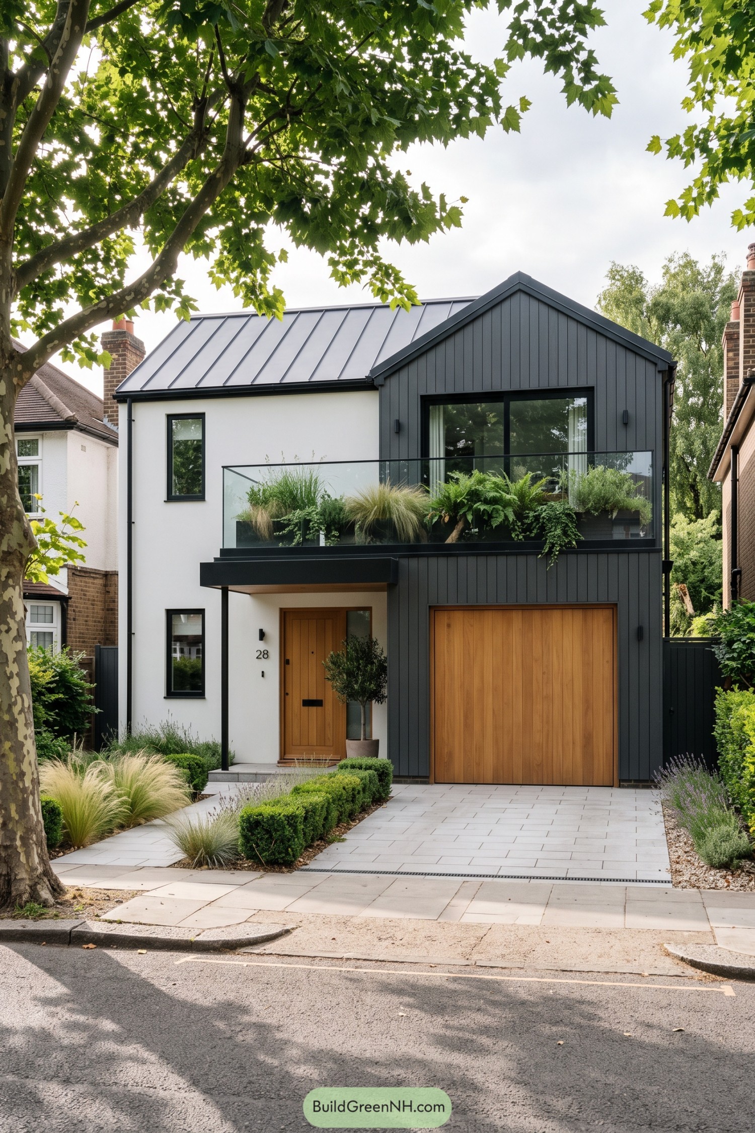 Modern gable home with planted glass balcony and timber garage
