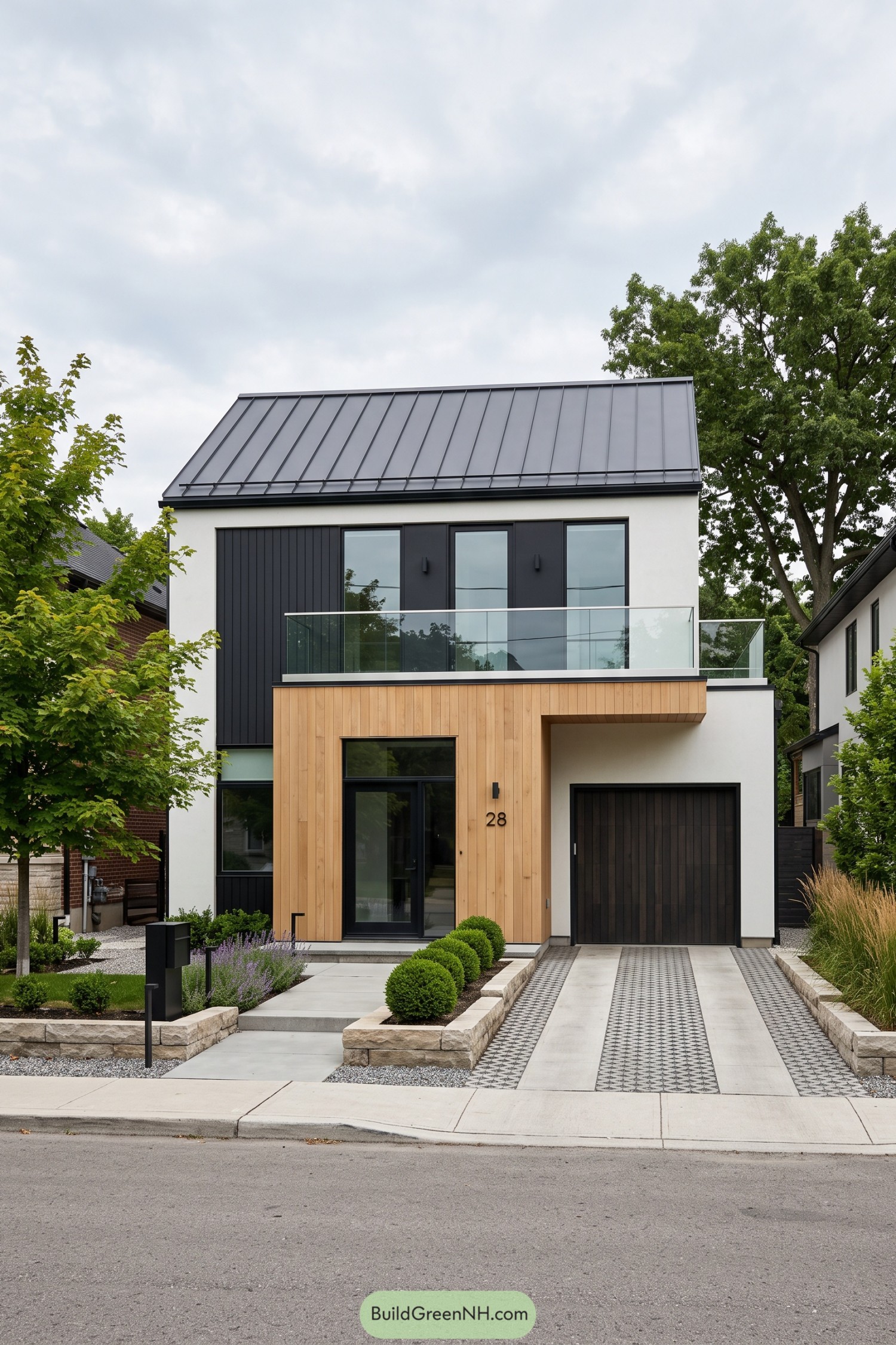 Modern gable home with glass balcony and cedar entry