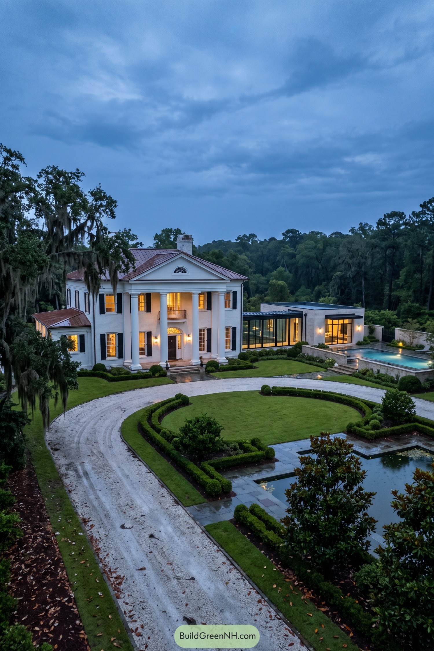 White columned home with a modern glass pool wing