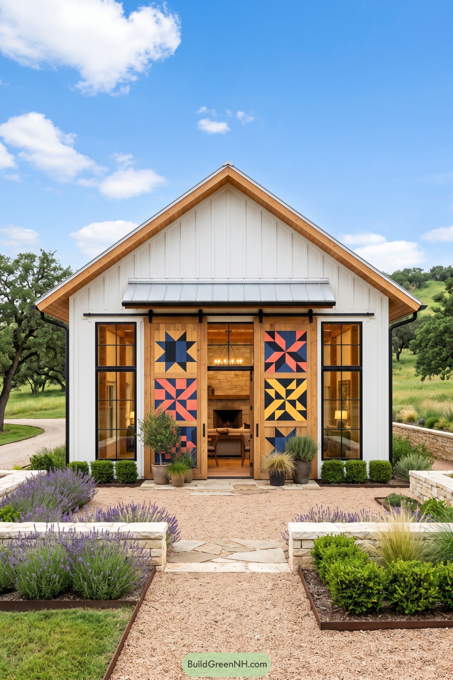 White gabled barndominium with colorful geometric barn doors