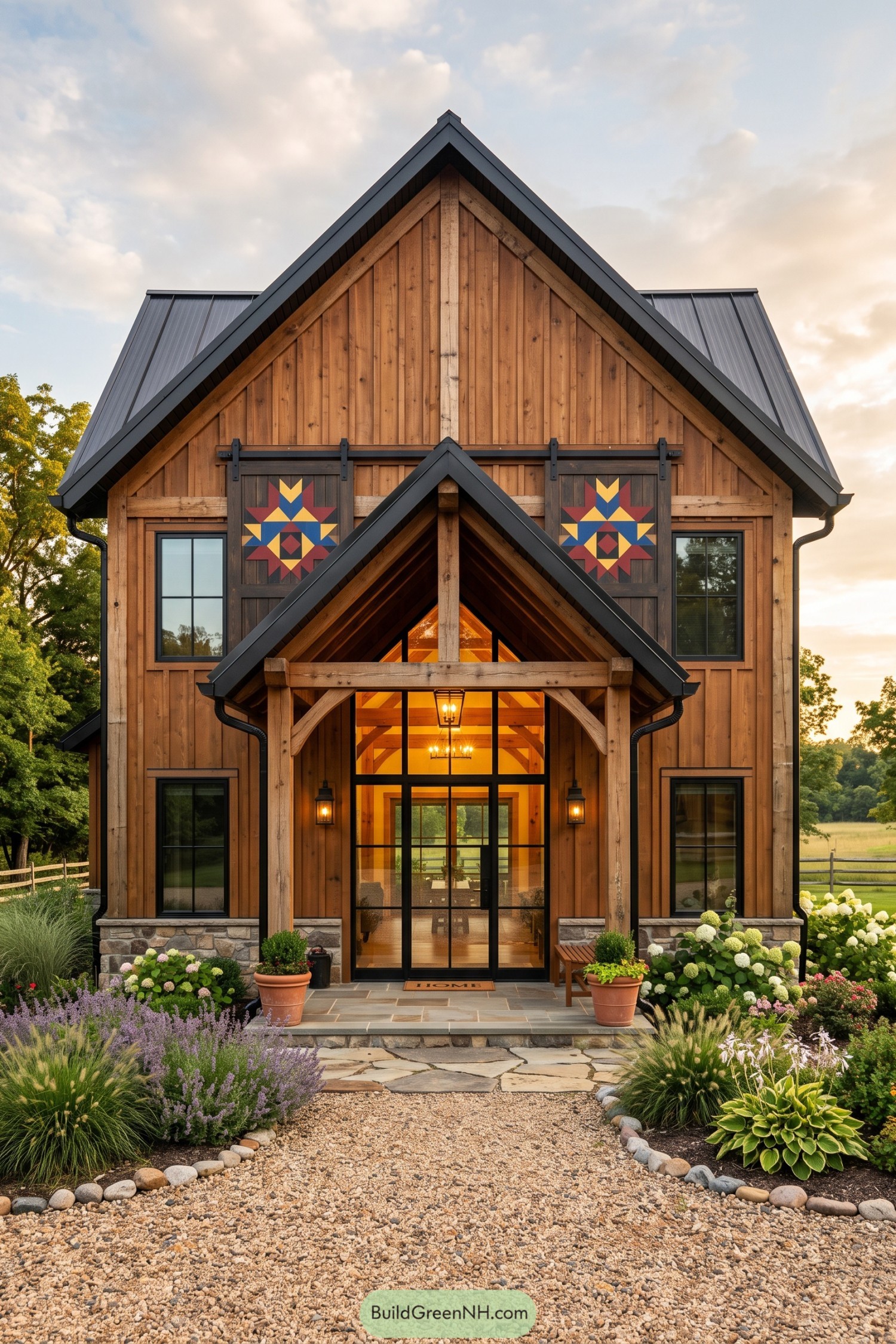 Timber barndominium with quilt-pattern barn doors and a glass entry
