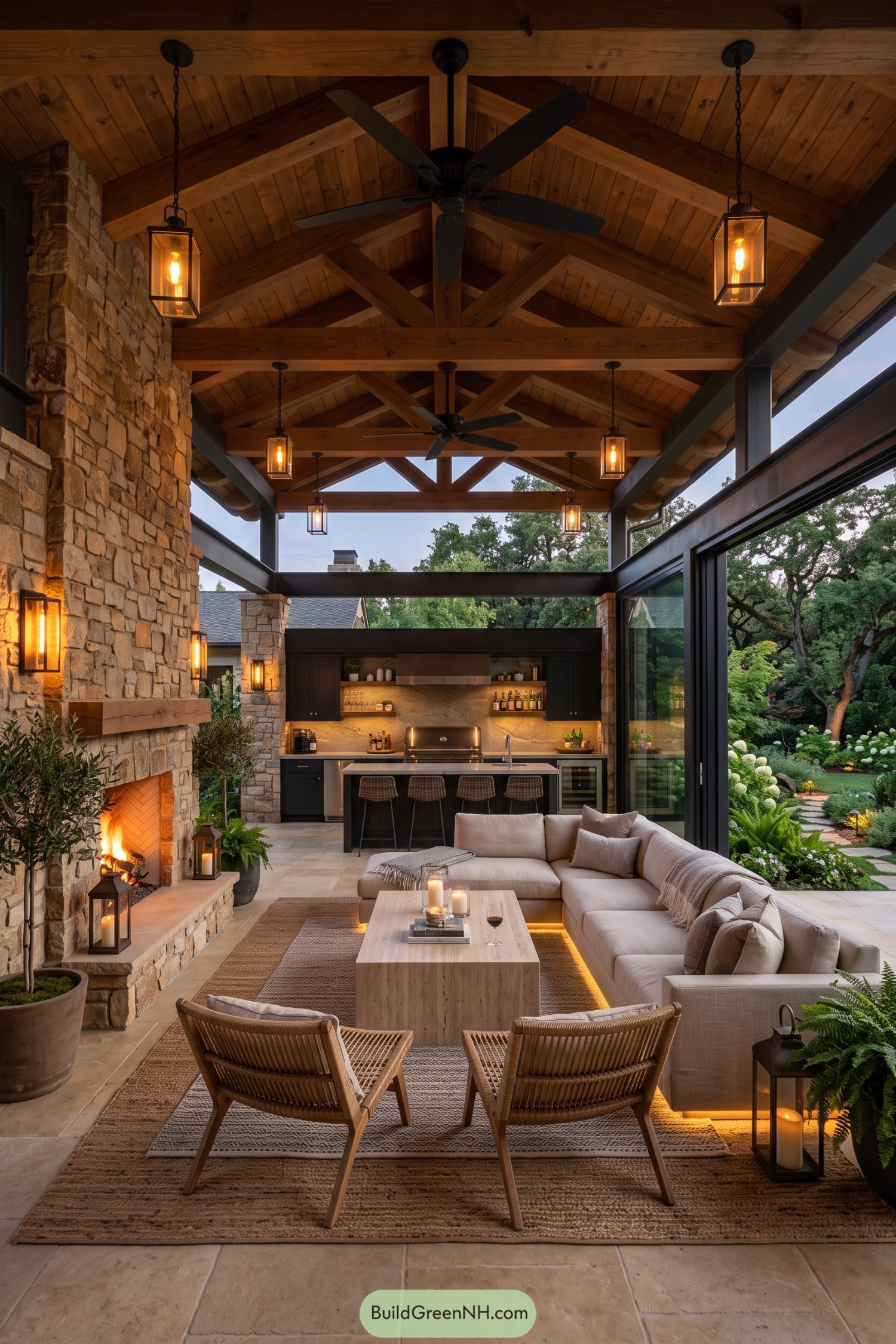 Covered patio with stone fireplace outdoor kitchen and lounge seating
