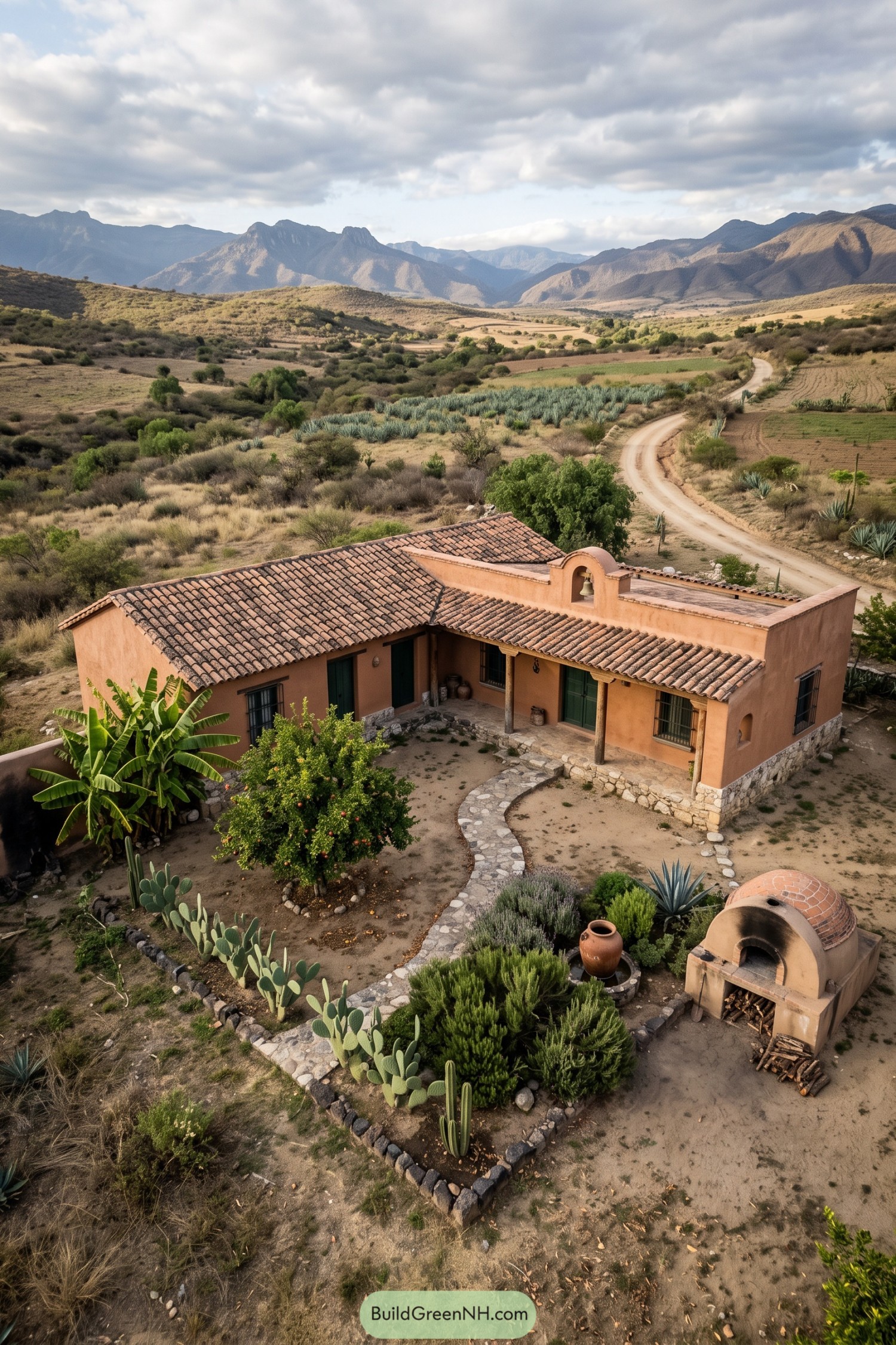 Terracotta ranch house with courtyard oven and mountain views