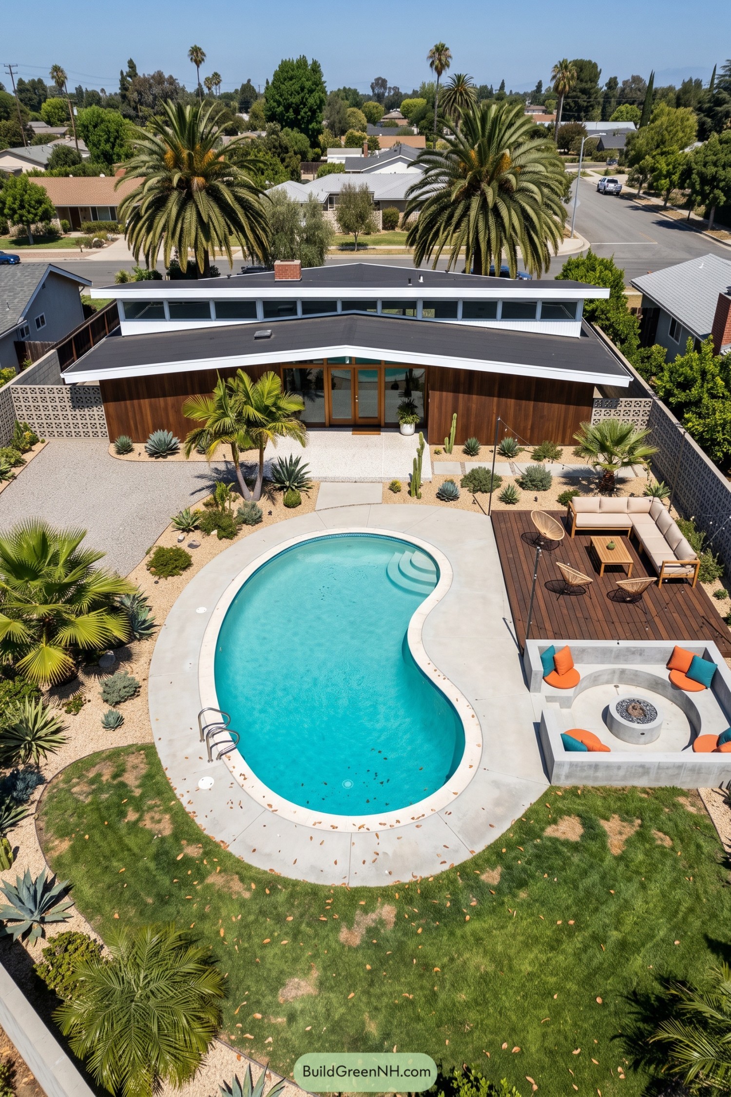 Curved pool with deck lounge and fire pit