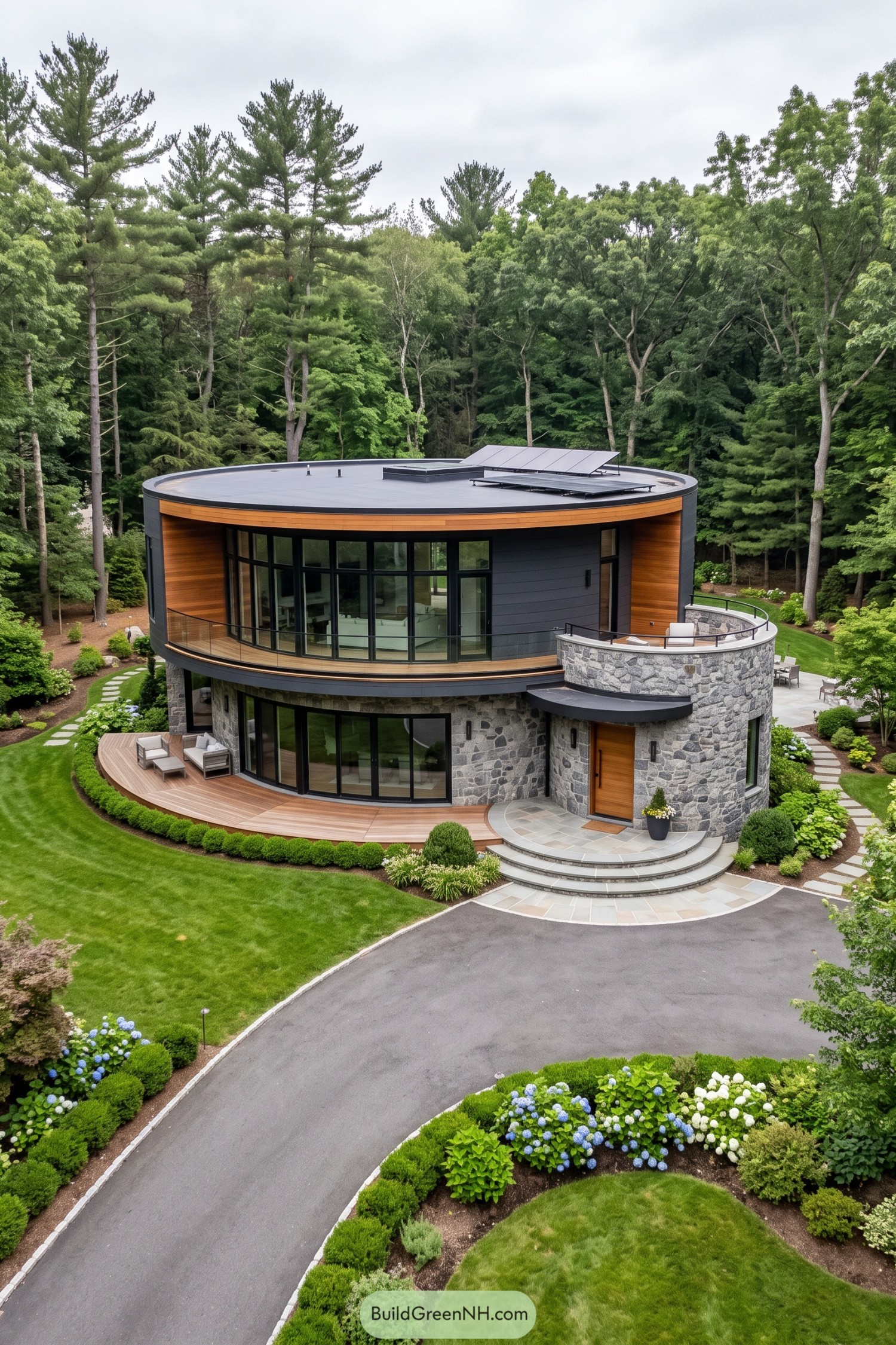 Two-story circular home with stone walls solar panels and curved glass