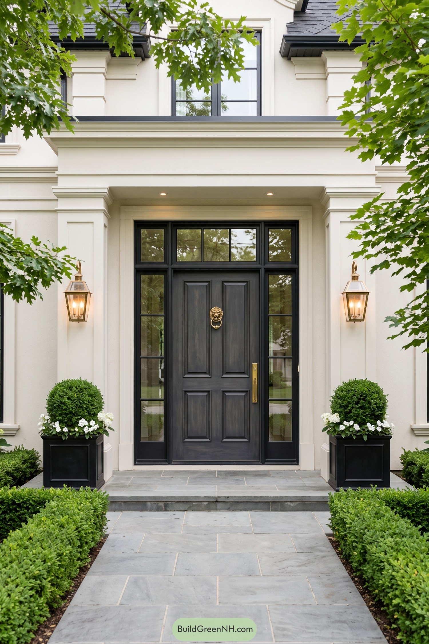 Charcoal paneled entry door with brass lion knocker and sidelights