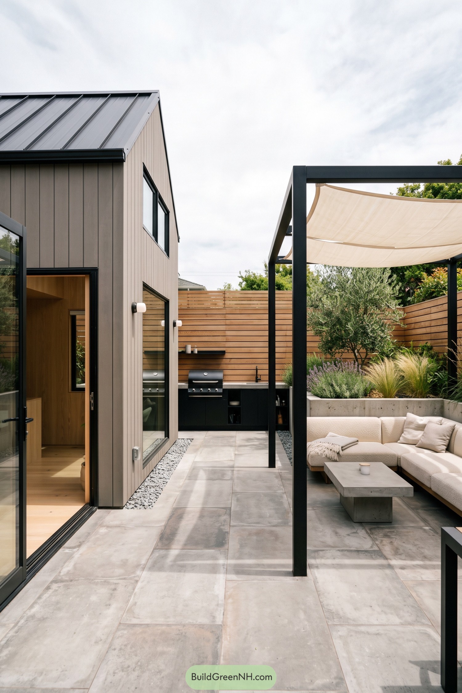 Compact barn house with a shaded patio kitchen and lounge