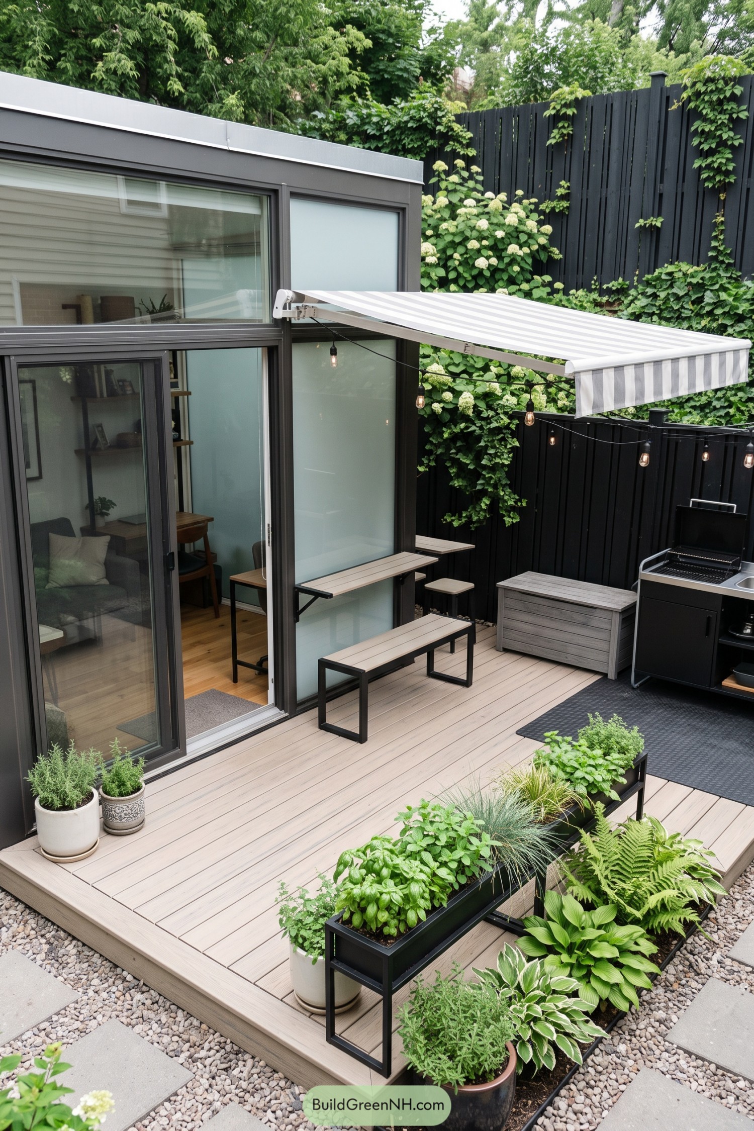 Compact glass microhome with a striped patio awning