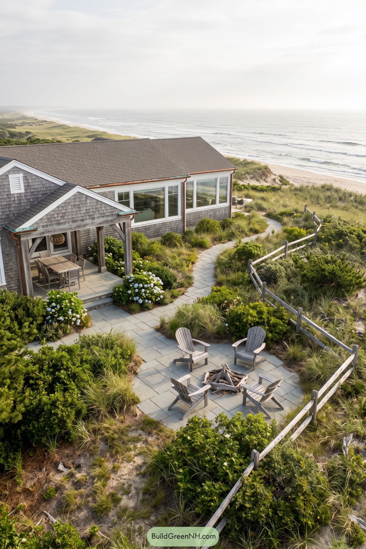 Shingled coastal ranch with dune garden and fire pit patio