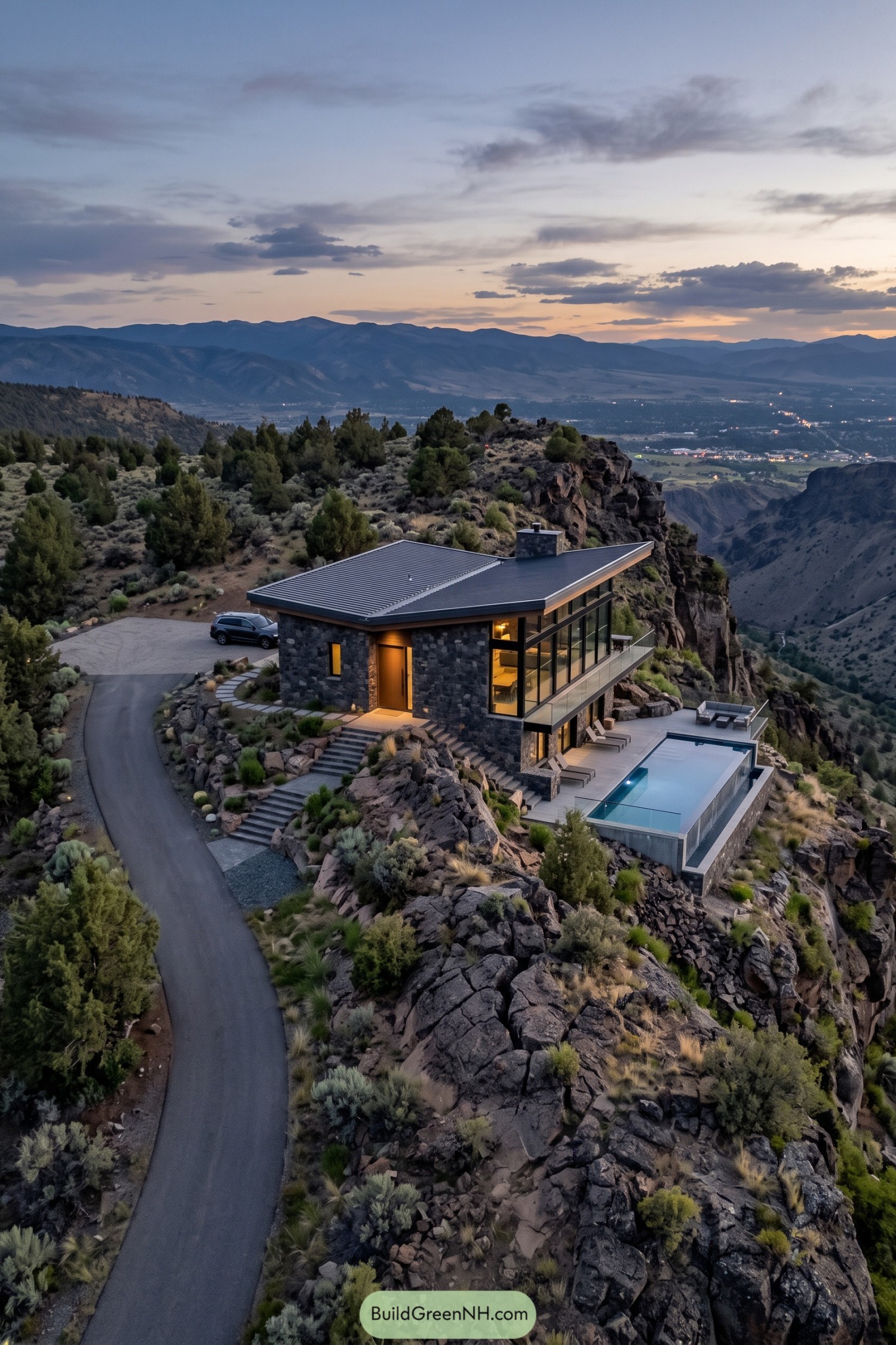 Stone cabin with an angular metal roof and an elevated rectangular pool overlooking a rugged canyon
